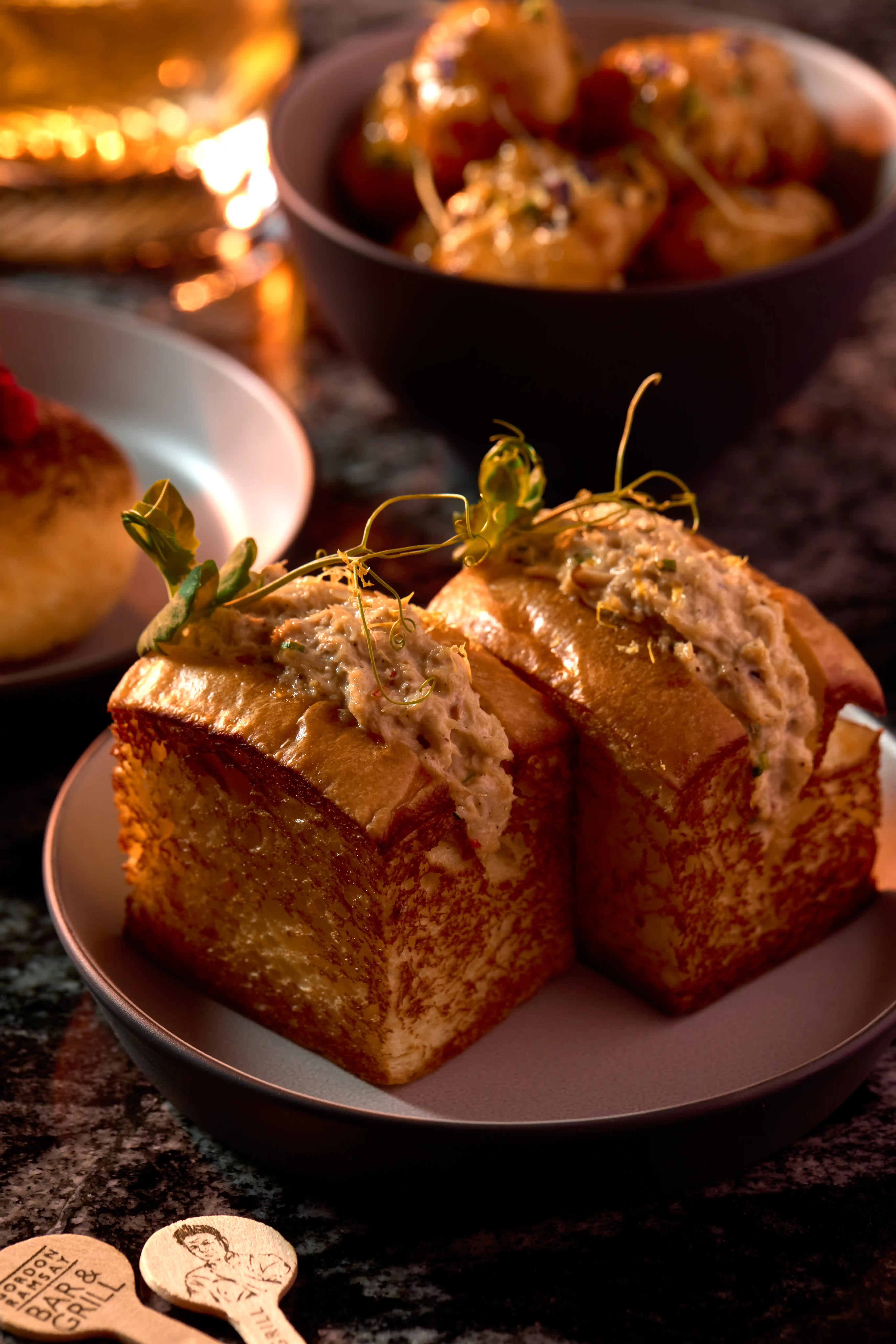 Brioche Crab Roll with Avocado; Meatballs & Creamy Polenta with Tomato sauce and Cheddar; Indian Ocean Tiger Prawns in Sour & Spicy Glaze; and Homemade Raspberry Filled Beignet