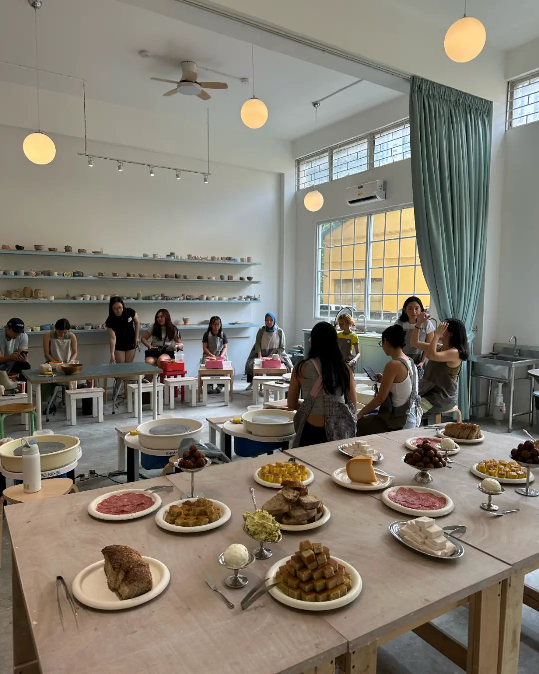 Guests are taught to use the pottery wheel