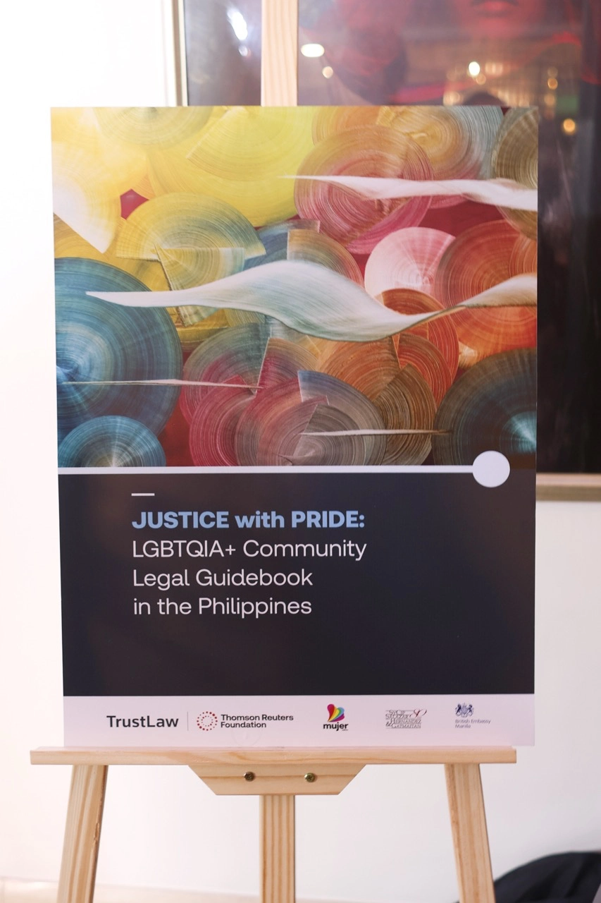 A print featuring the cover of "Justice with Pride: LGBTAQIA+ Community Legal Guidebook in the Philippines"