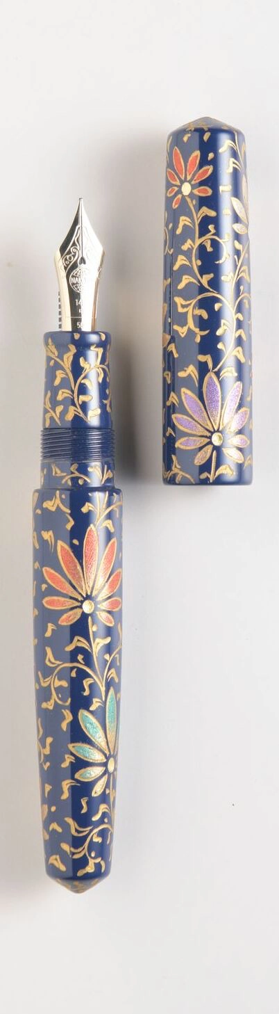 Fountain Pens That Are Functional Masterpieces A Cigar Piccolo PALMET (Kikyo Colorful Lines) Nakaya pen, featuring a floral design made with colored powders; and a Cigar Piccolo ENJOYING THE MOON CAT