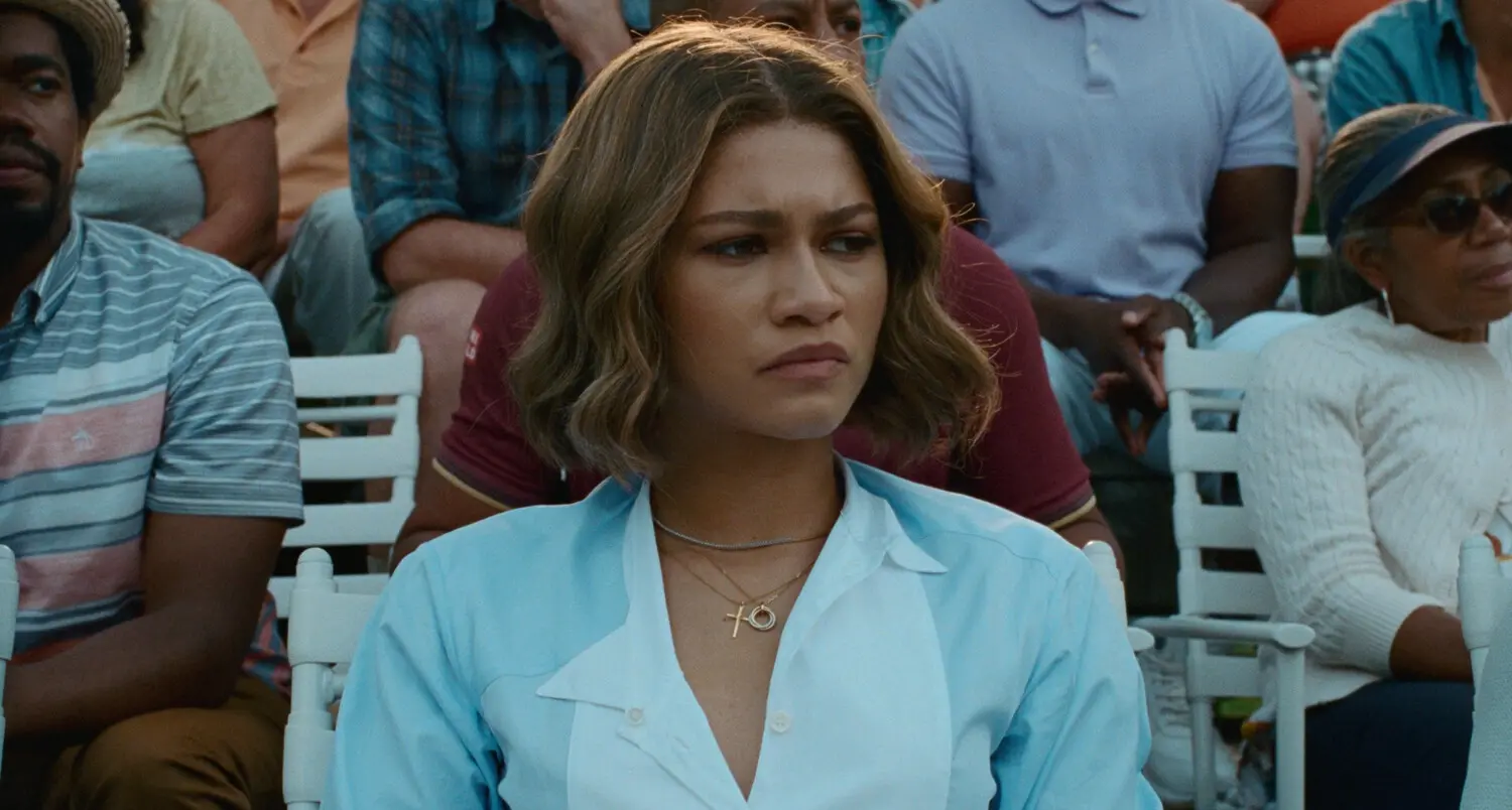 Tashi (Zendaya) watches the heated match between old-flame Patrick (Josh O'Connor) and husband Art (Mike Faist)