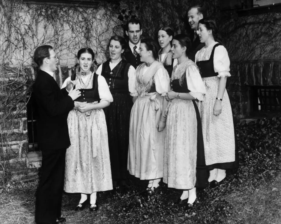 The real Trapp Family Singers rehearsing in America in 1941. Leading them is Father Franz Wasner, who was omitted from The Sound of Music