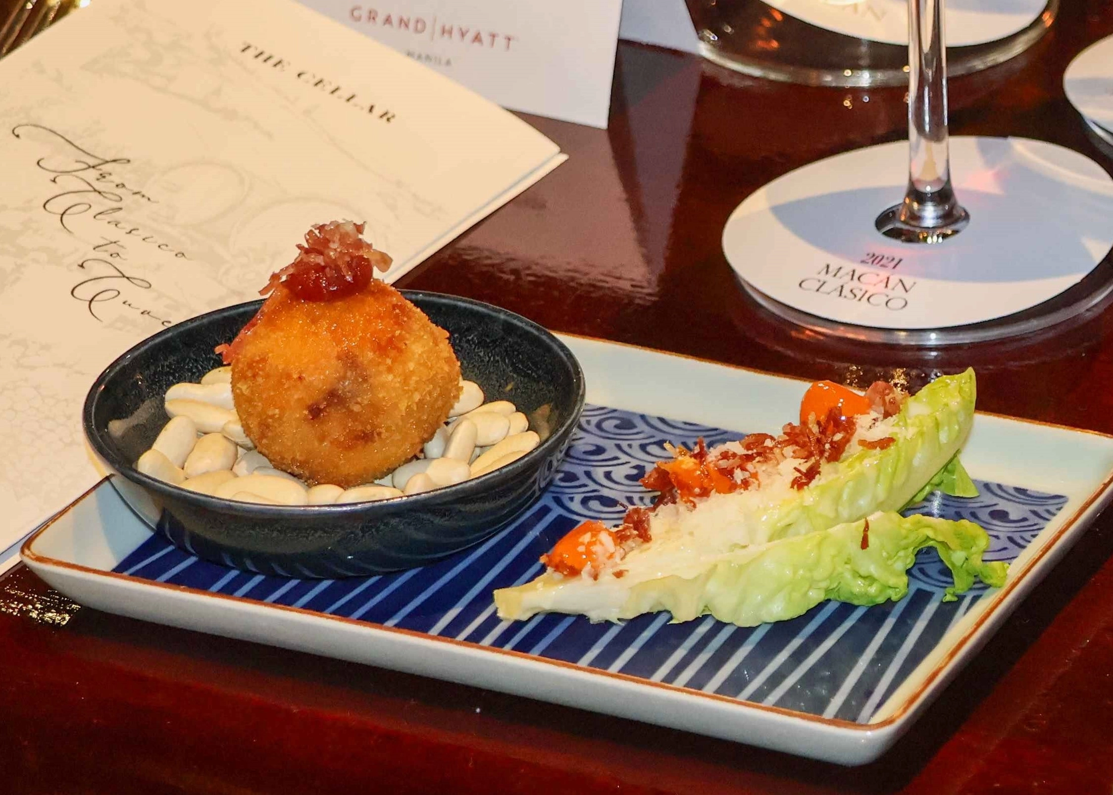 Caesar and Jamon Iberico Croquette; An assortment of pintxos: Boquerones, Grass-Fed Rib Eye, Pork Belly and Goat Cheese with Figs Compote; and Chicken and Chorizo Paella