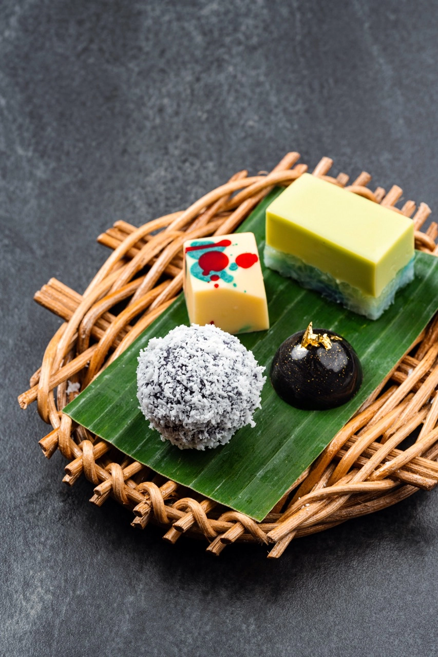 Petit Fours (clockwise, from the top): Kueh Sala Coconut Pandan Custard; Dark Chocolate Bonbon filled with buah keluak and chili salted caramel ganache; Putli Mandi; Biyaki White Chocolate Singapore
