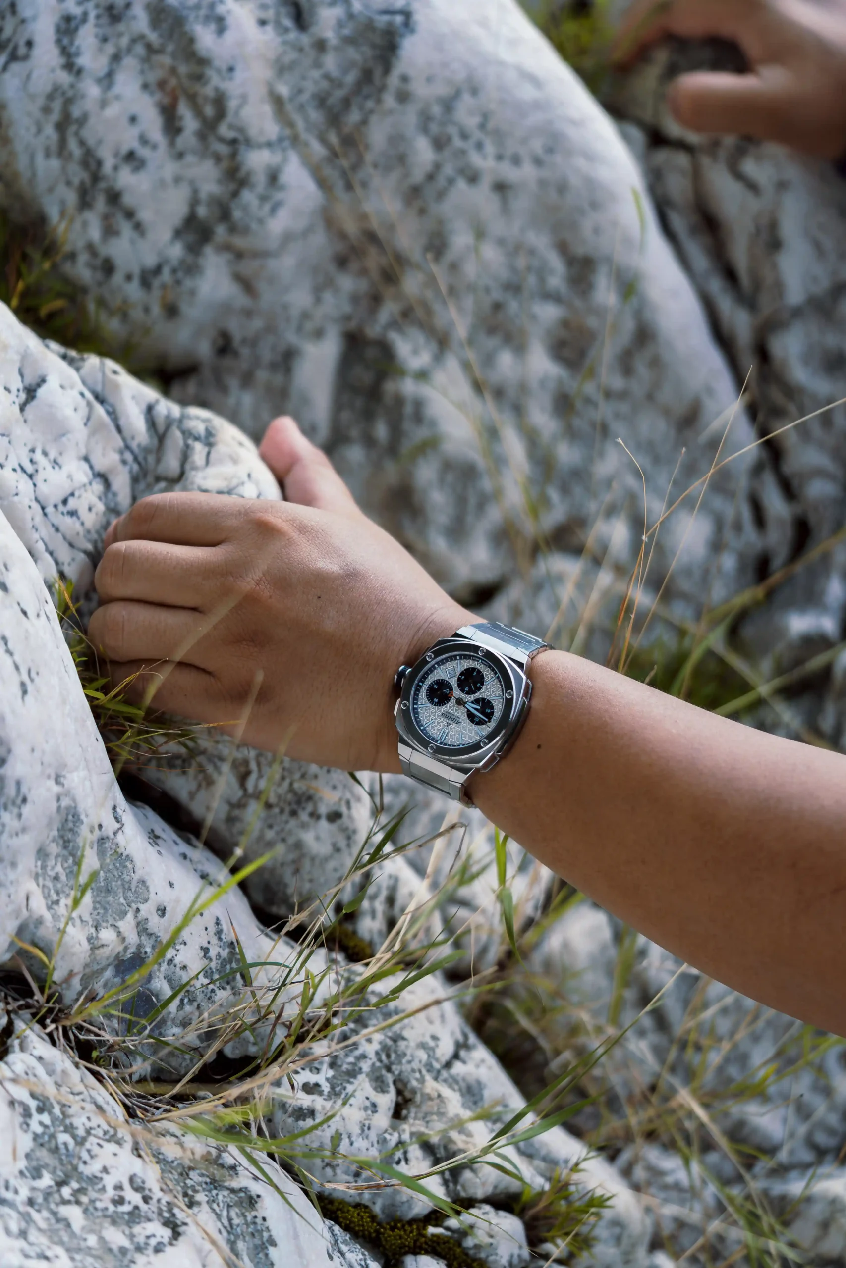 Jeno Panganiban climbs mountains in an Alpina Alpiner Extreme Chronograph Automatic 