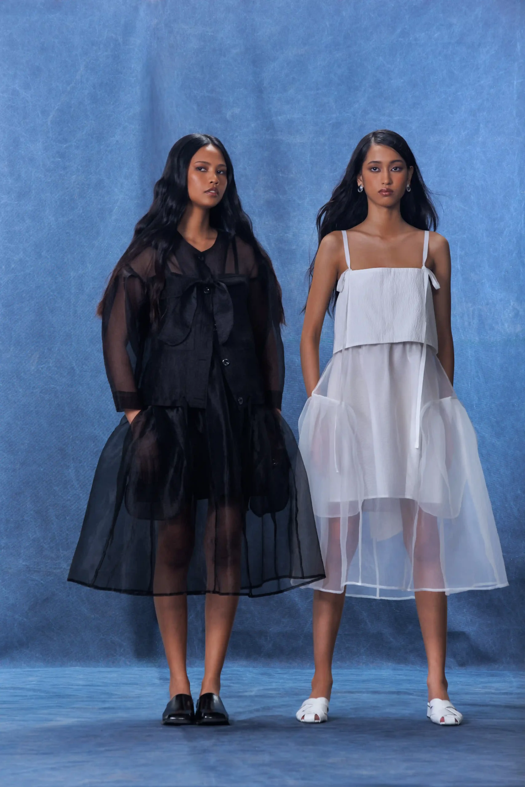 Two looks from the new RAF x Nicolo collection "Untraje"