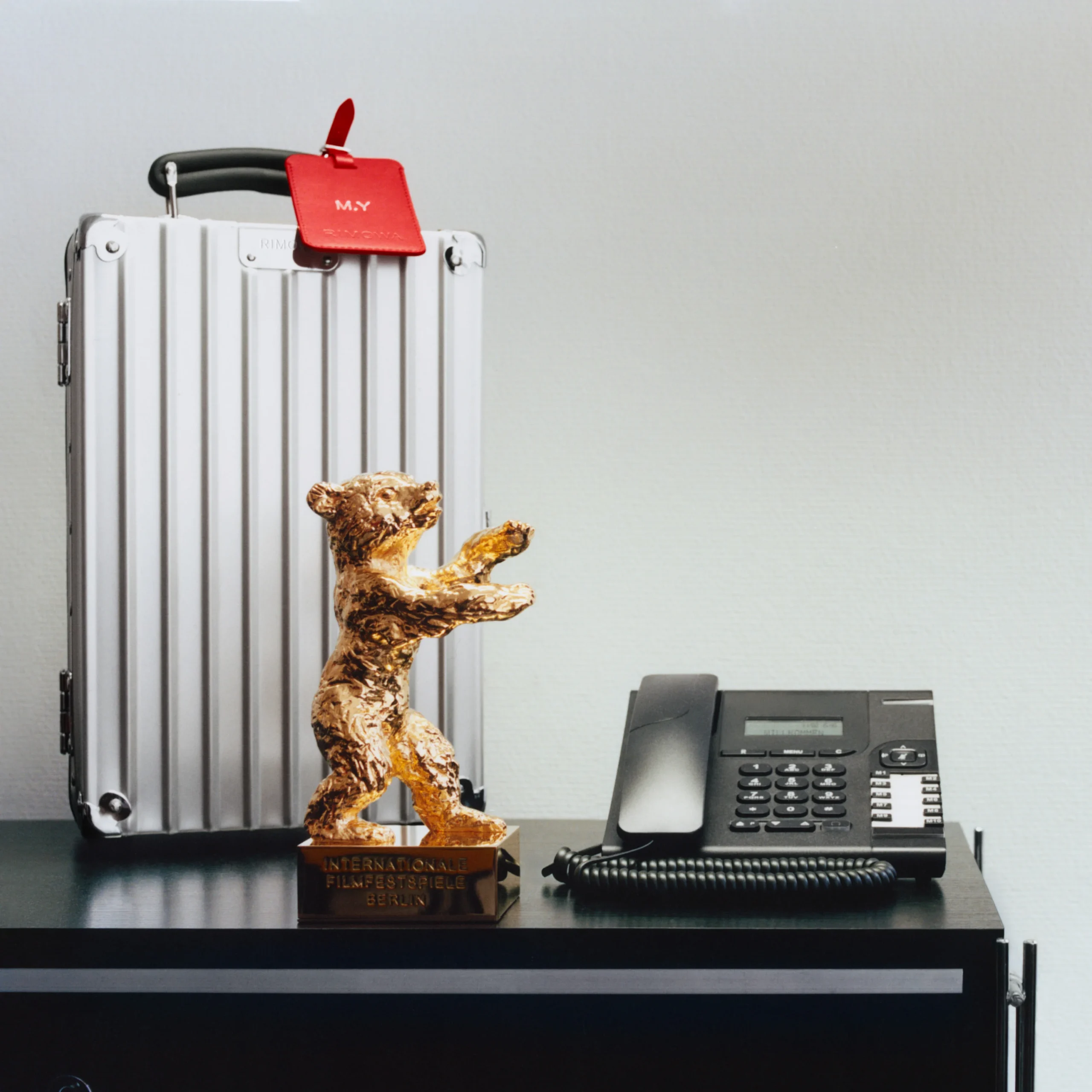 Michelle Yeoh's Honorary Golden Bear beside its bespoke Rimoawa carrying case