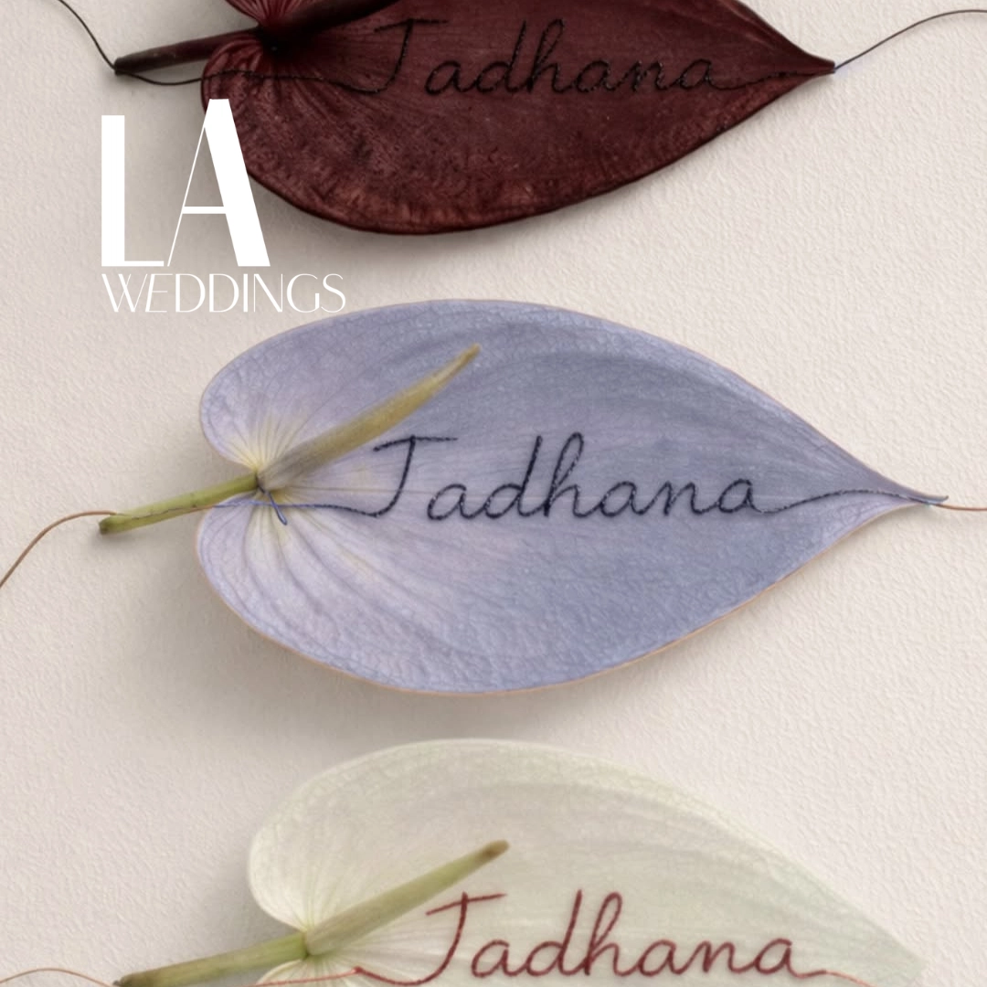 Pastel leaves with handwritten 'Tadhana' and a white 'LA Weddings' logo overlay, serving as wedding branding imagery / Photo via Instagram @tadhanabridalfair.ph