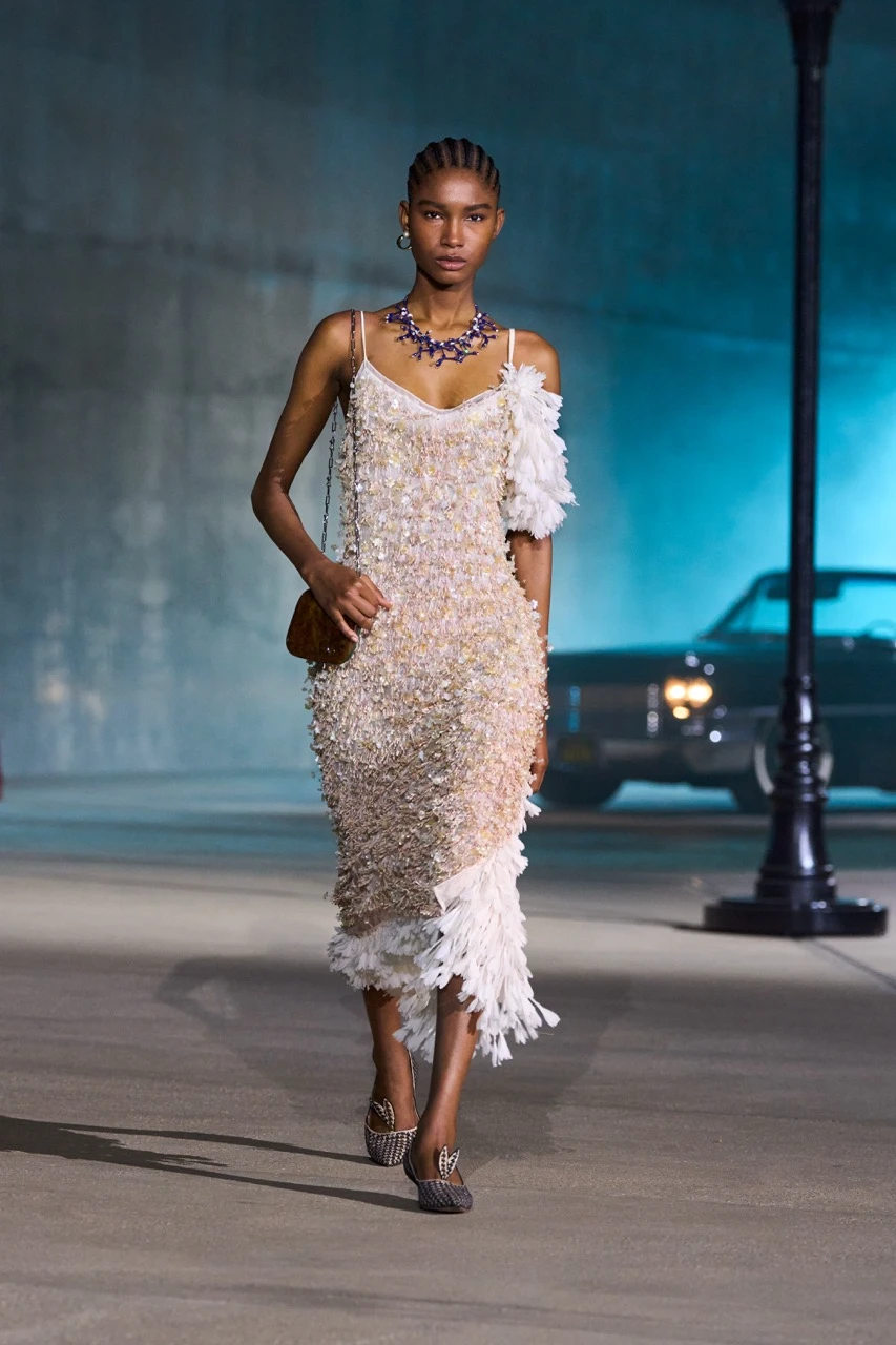 Dior Cruise 2027 collection look by Jonathan Anderson featuring a shimmering, embellished dress with floral shoulder details
