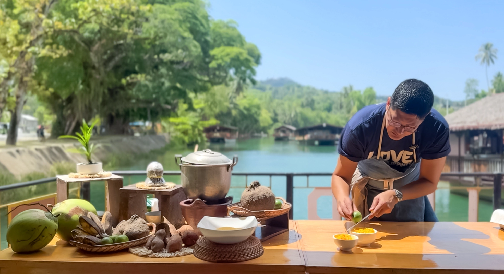 Chef Angelo Comsti prepares a meal on a cruise along the Loboc River