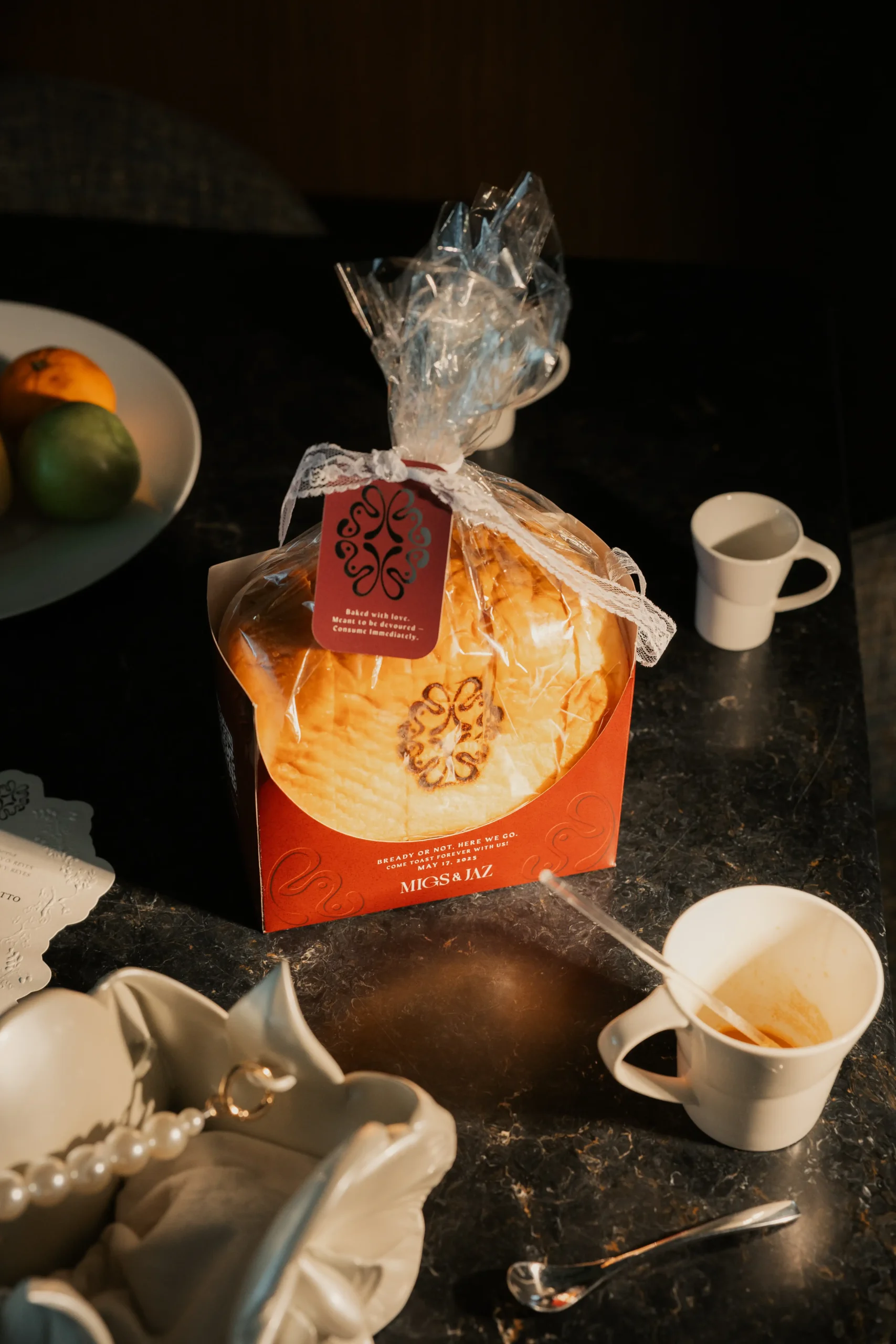 A closer look at the creative bread loaf wedding invite for Miguel Sotto And Jazmin Reyes' wedding, made with the help of the Bridal Brand Bible team and Daniel Bakery
