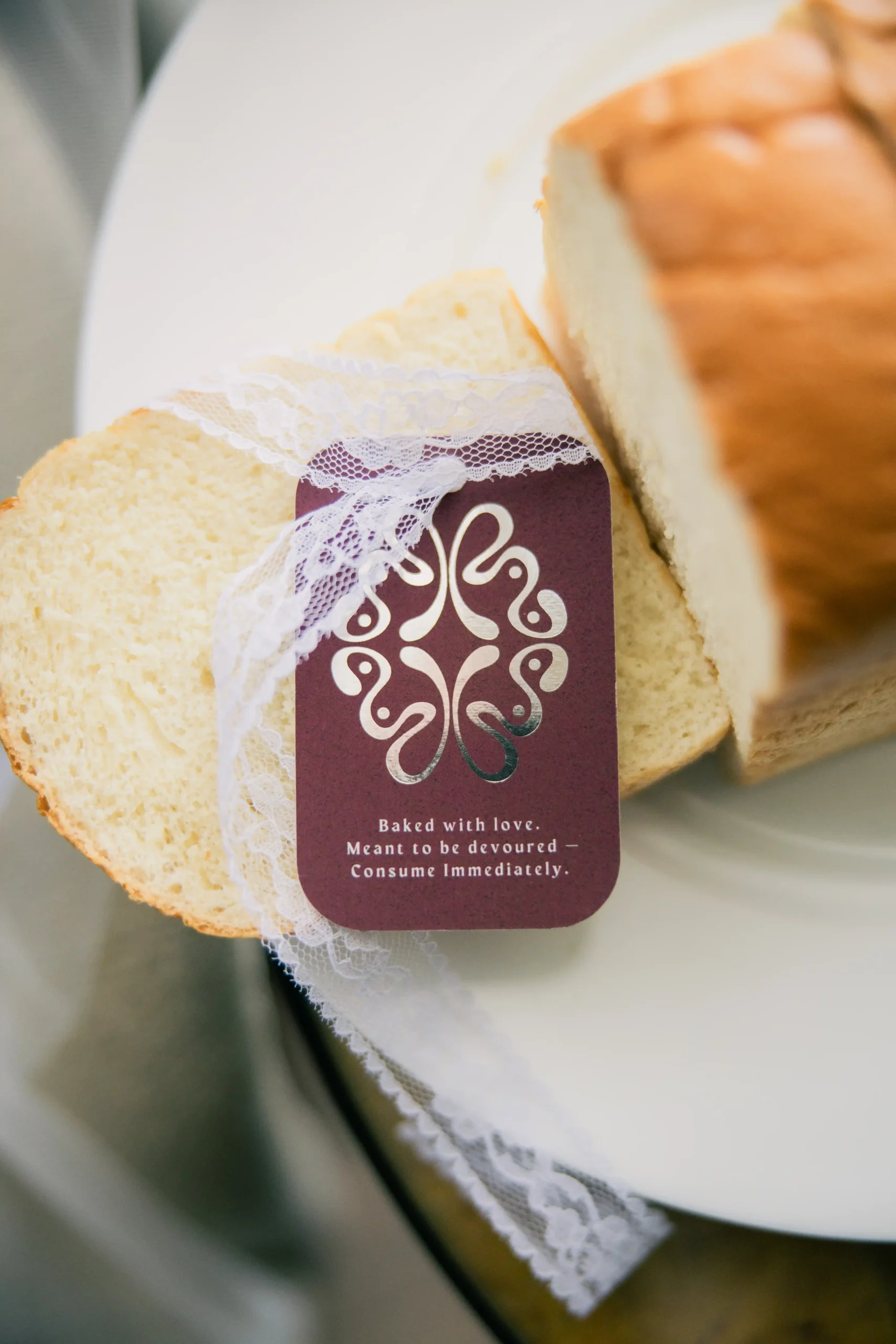 A closer look at the creative bread loaf wedding invite for Miguel Sotto And Jazmin Reyes wedding, made with the help of the Bridal Brand Bible team and Daniel Bakery
