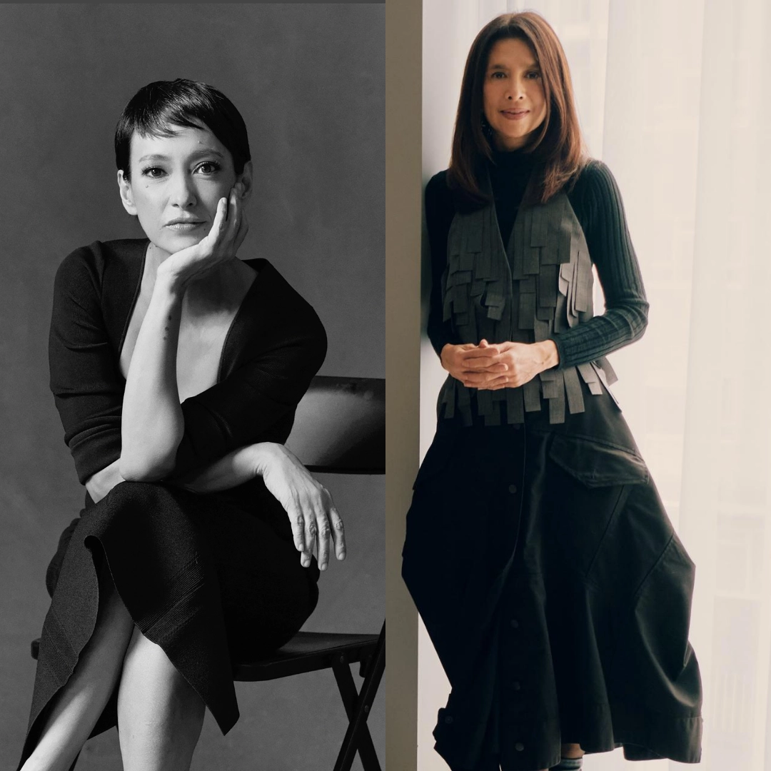 Black-and-white portrait of a woman seated, resting her chin on her hand, wearing a black knit dress.