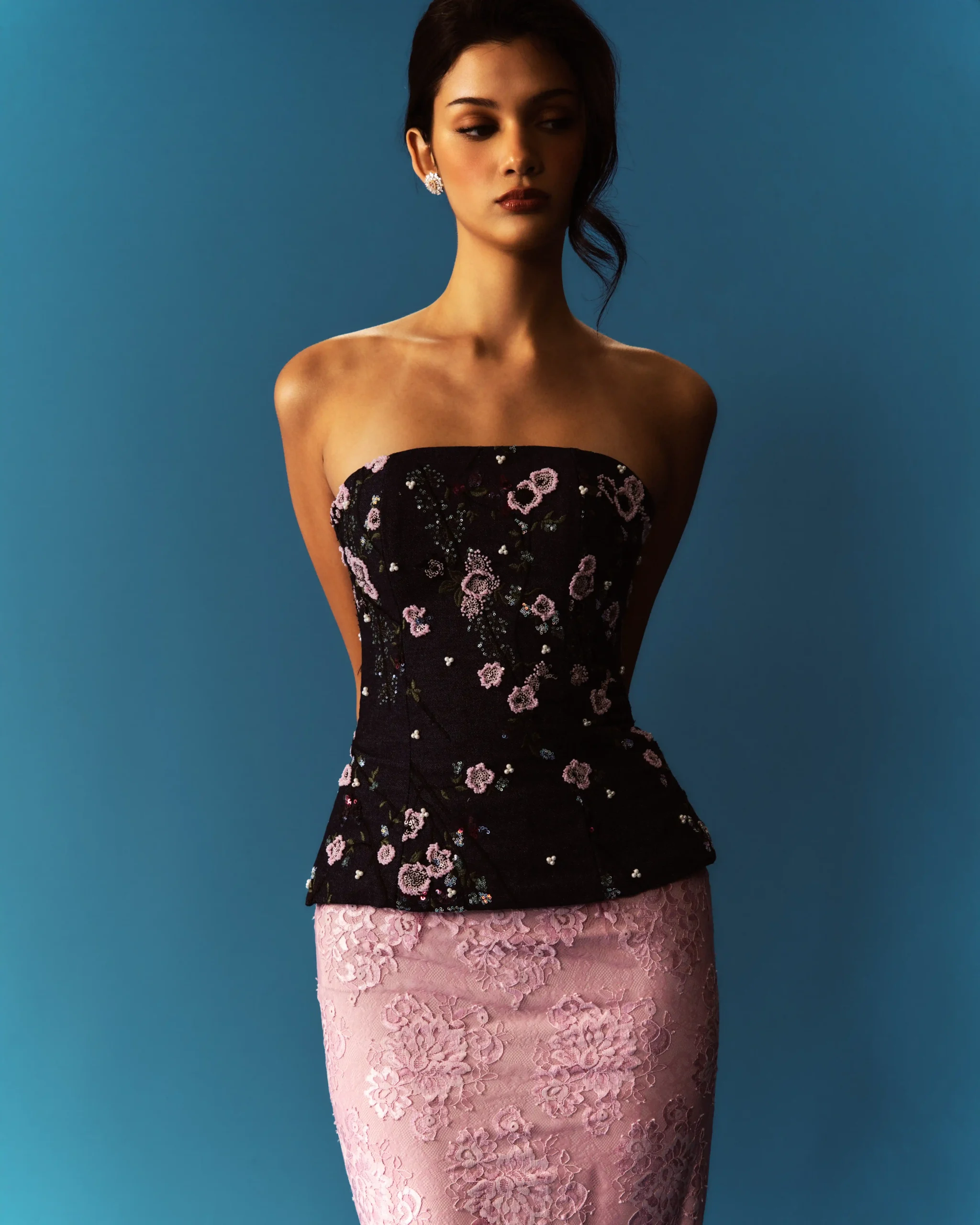 Black embroidered top and pink skirt by Atelier Carlene