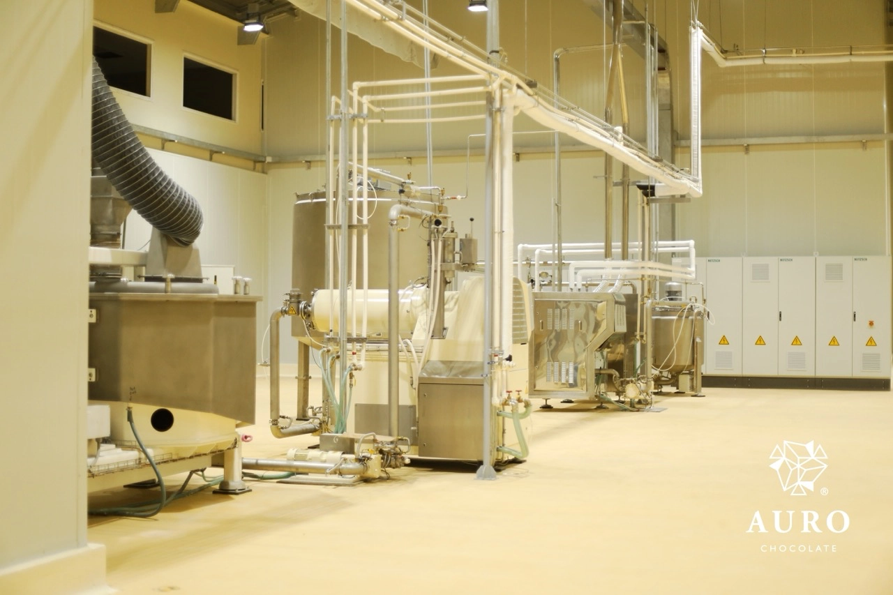 Auro Chocolate’s premium-quality cacao beans are shipped to the company’s state-of-the-art processing facility; here, the beans are roasted and transformed into a range of products