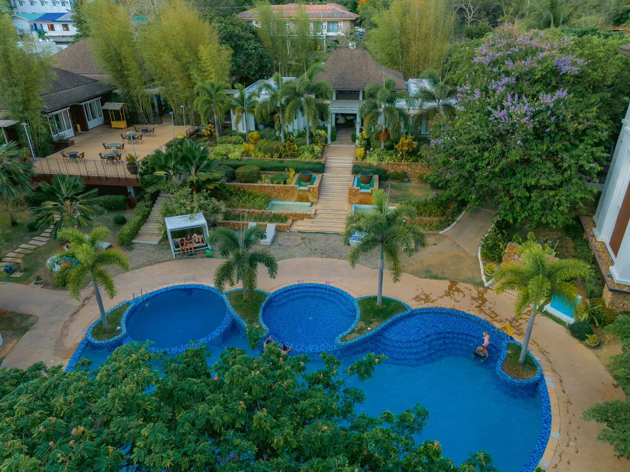 An aerial view of Bacau Bay Coron and its pool