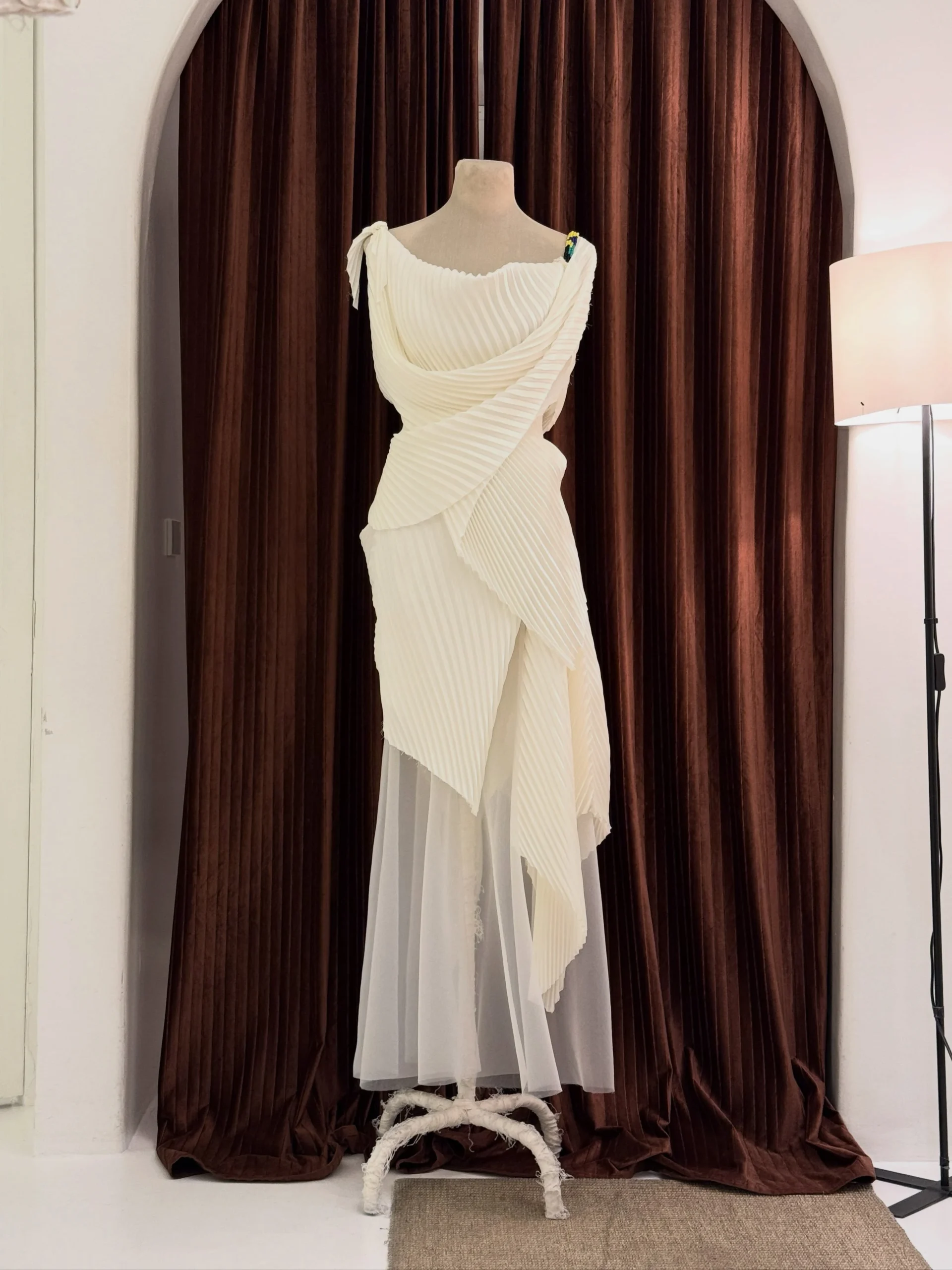 “Super plissé” pleated freehand draped dress in ivory crêpe satin by Jude Macasinag