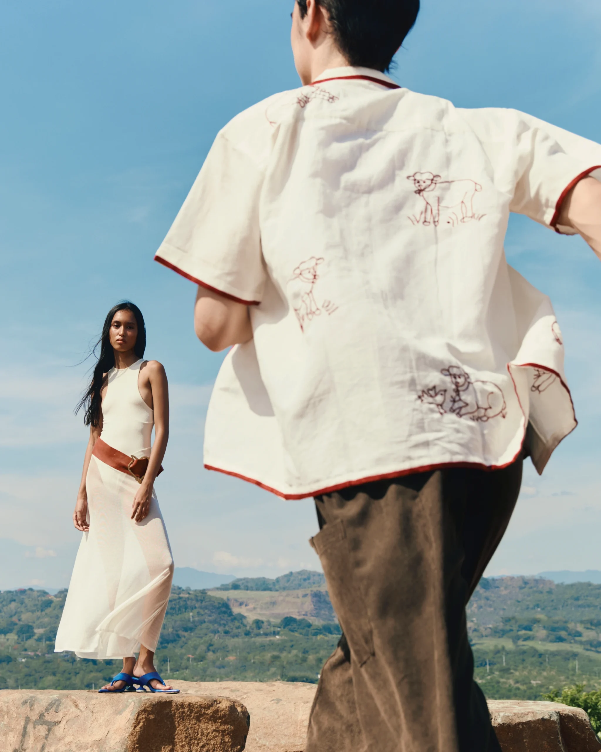 Lake wears ISA BOULDER dress,
GLORIAE belt and heels, and OABO bag. Eugene wears HARAGO shirt, and SEIRE trousers