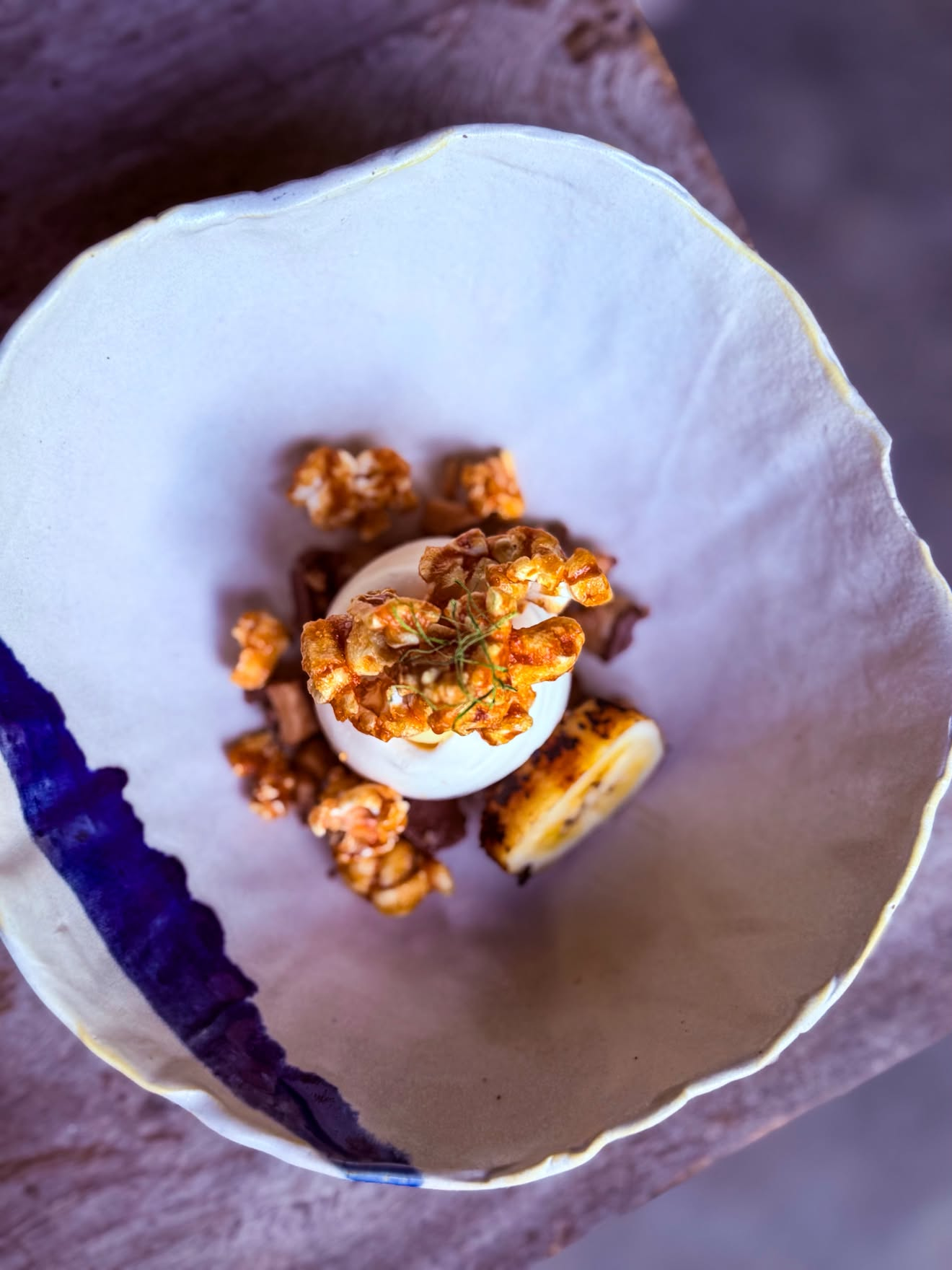 Mrs. Saldo’s 8-Boob Collab À La Natin
"The Tina" by Chef Rhea Rizzo features calamansi meringue, castanas purée, grilled coconut saba, milk chocolate, almond crunch, patis caramel popcorn, and kaffir