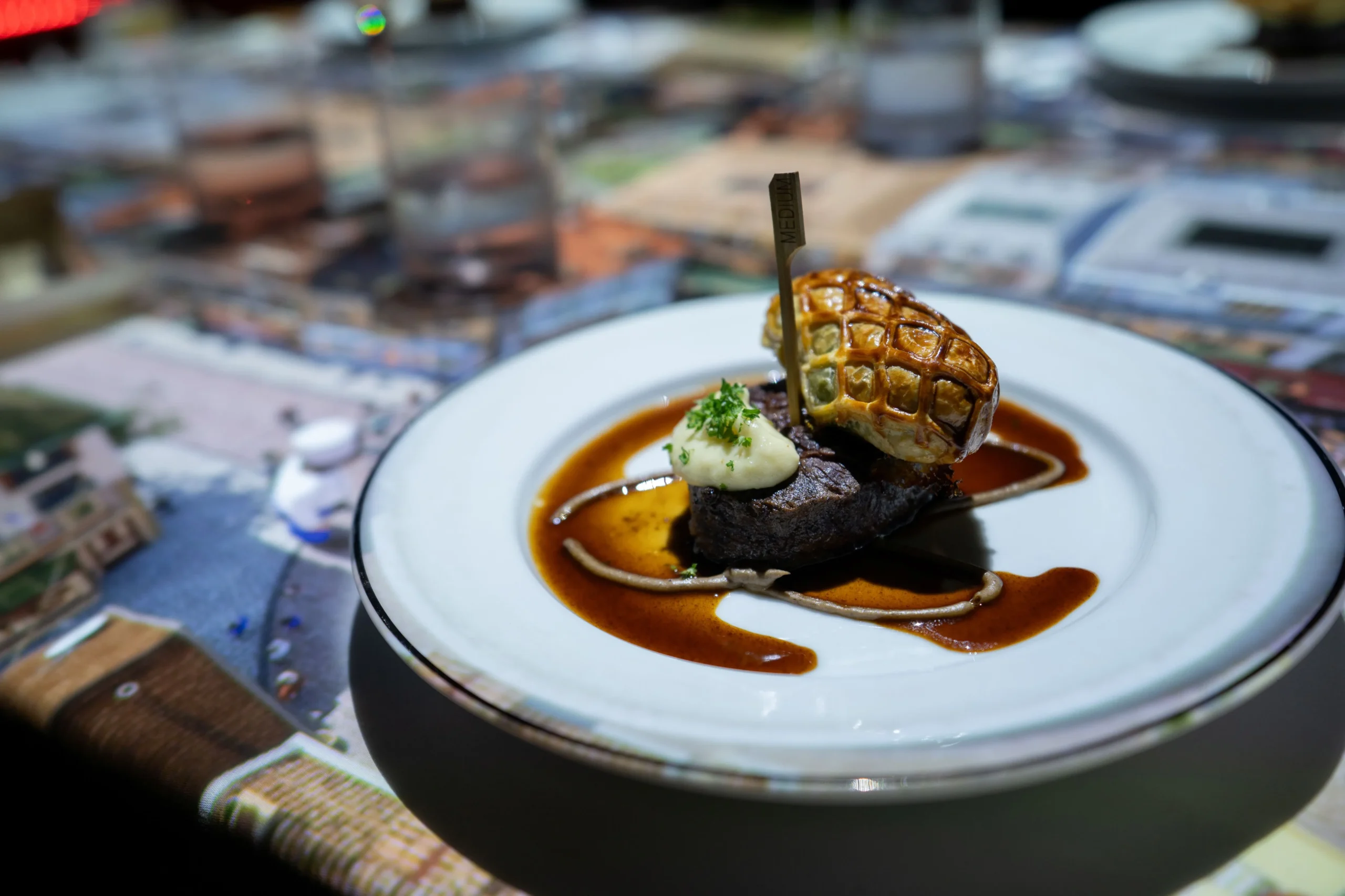 Bœuf en croûte: grilled Wagyu tenderloin with braised oxtail, spinach, mushrooms, and port wine jus