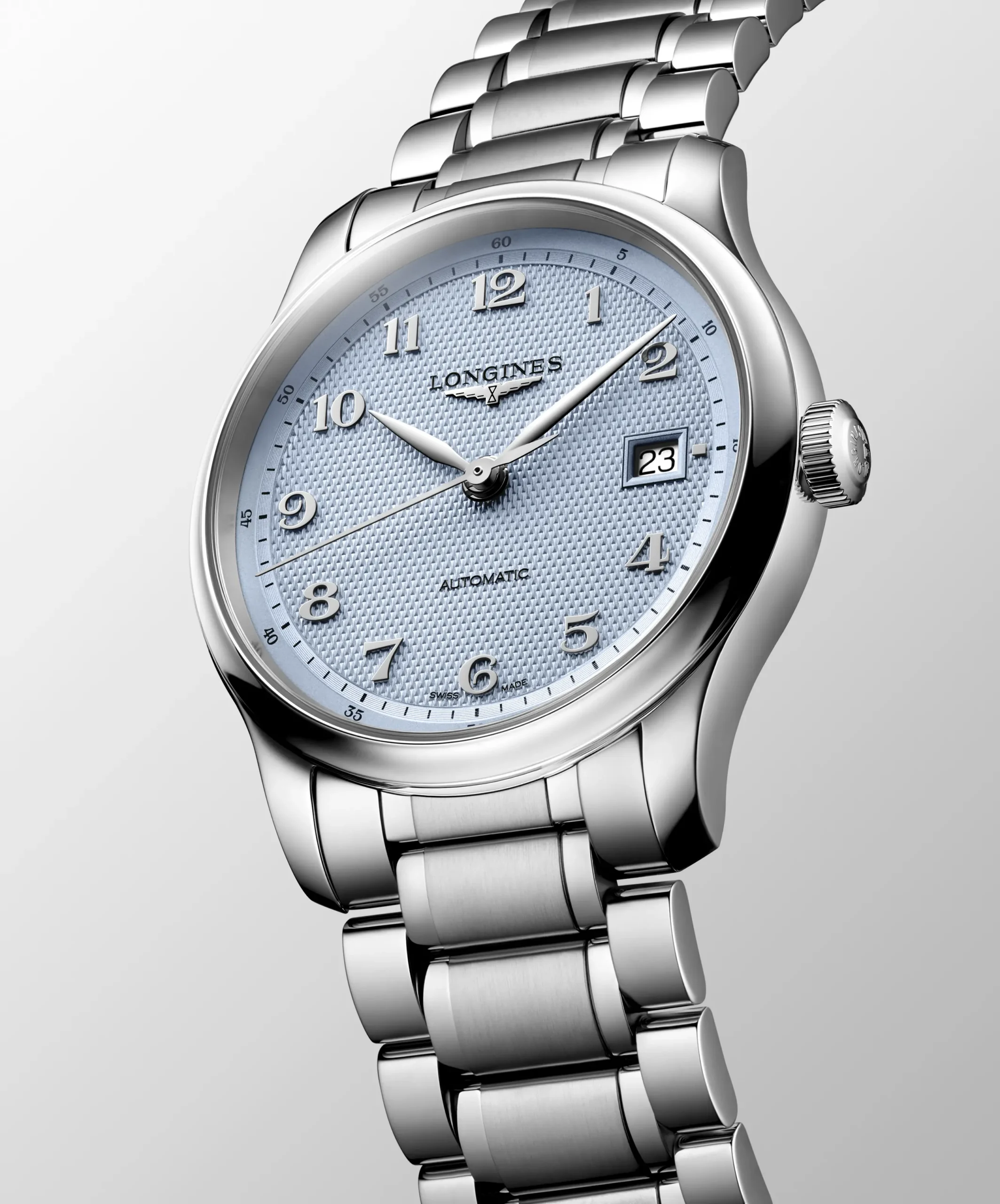The L2.949.4.99.6 (left), a 39-mm three-hand model featuring a light blue barleycorn dial with applied Arabic numerals, as well as a stainless-steel bracelet with newly designed shortened links and a new dedicated folding clasp featuring micro-adjustment. Beside it, the L2.950.4.99.2, a 41-mm model with a light blue barleycorn dial, applied Arabic numerals, and anthracite leather bracelet.