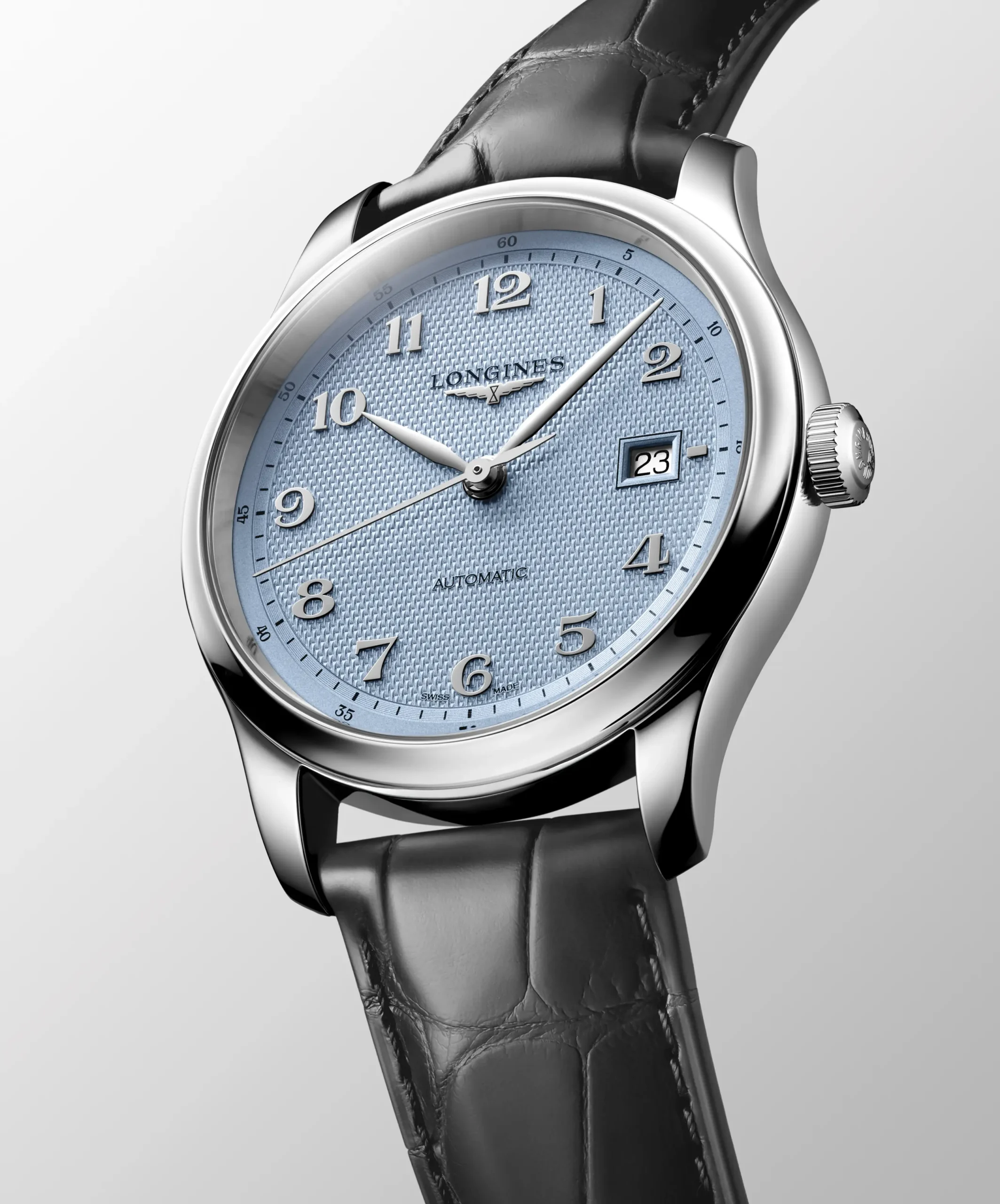 The L2.949.4.99.6 (left), a 39-mm three-hand model featuring a light blue barleycorn dial with applied Arabic numerals, as well as a stainless-steel bracelet with newly designed shortened links and a new dedicated folding clasp featuring micro-adjustment. Beside it, the L2.950.4.99.2, a 41-mm model with a light blue barleycorn dial, applied Arabic numerals, and anthracite leather bracelet.