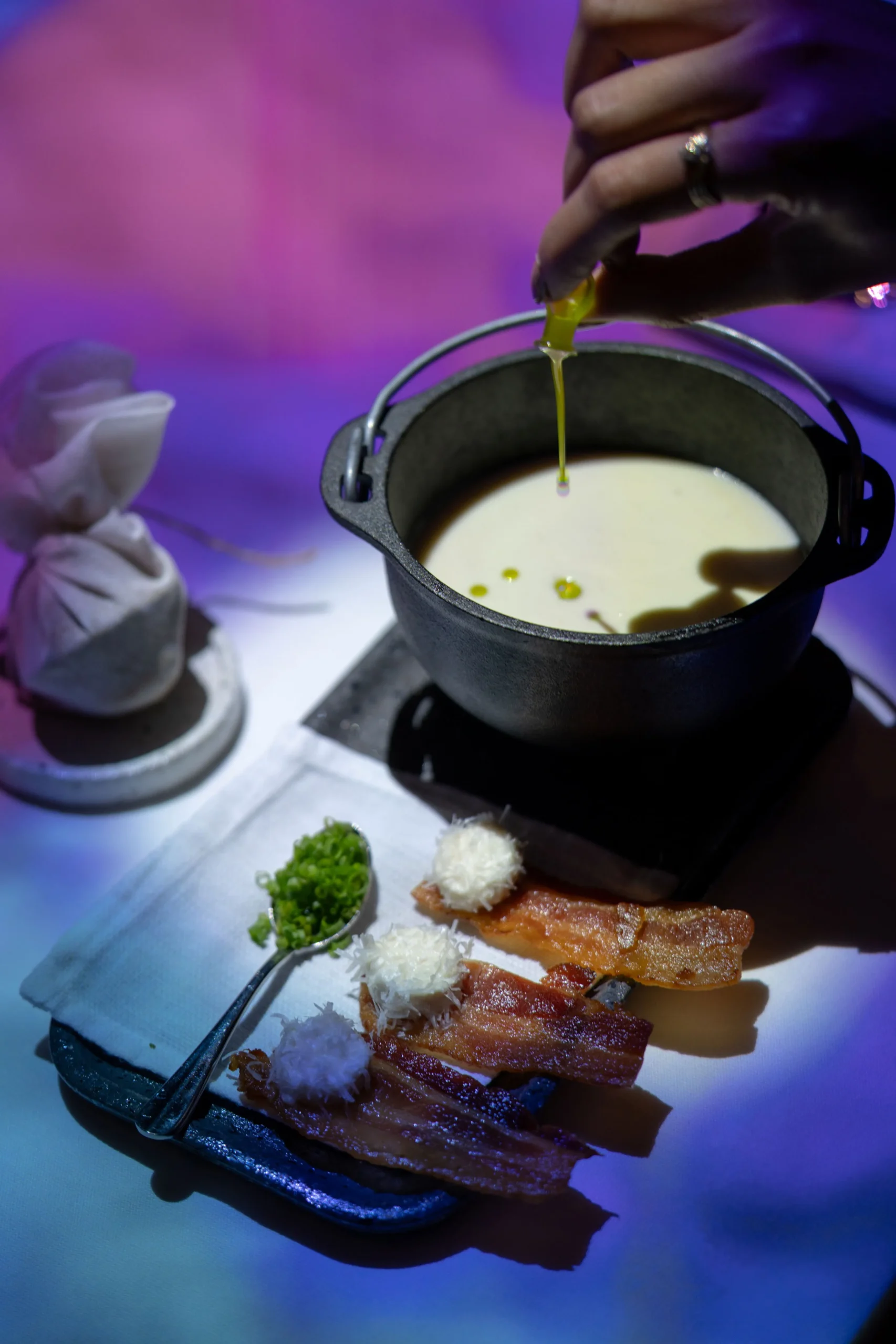 Magical Soup Kettle: parmesan Soup served with crispy bacon, homemade ricotta, and truffle dust