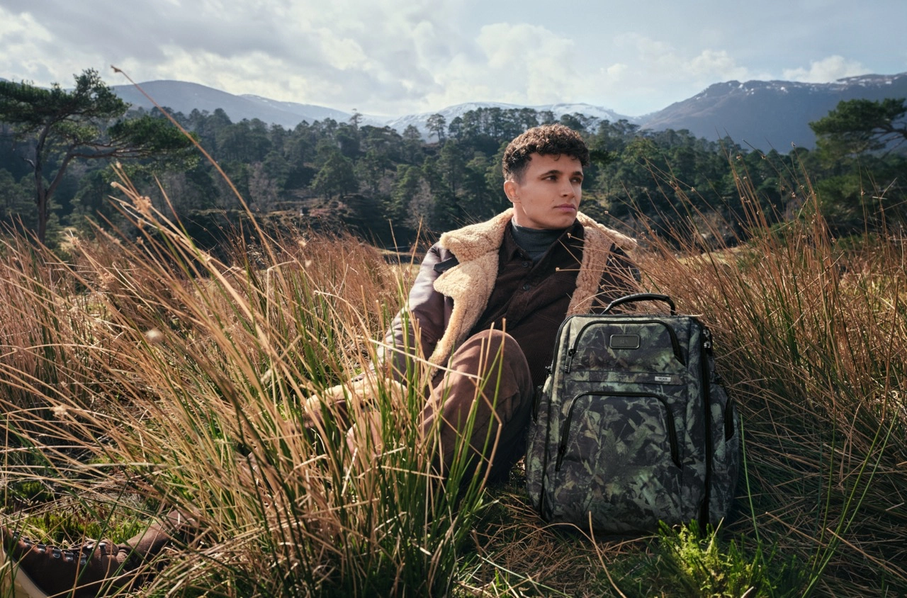 Lando Norris with the TUMI Alpha Brief Pack in Camo Fall/Winter 2026