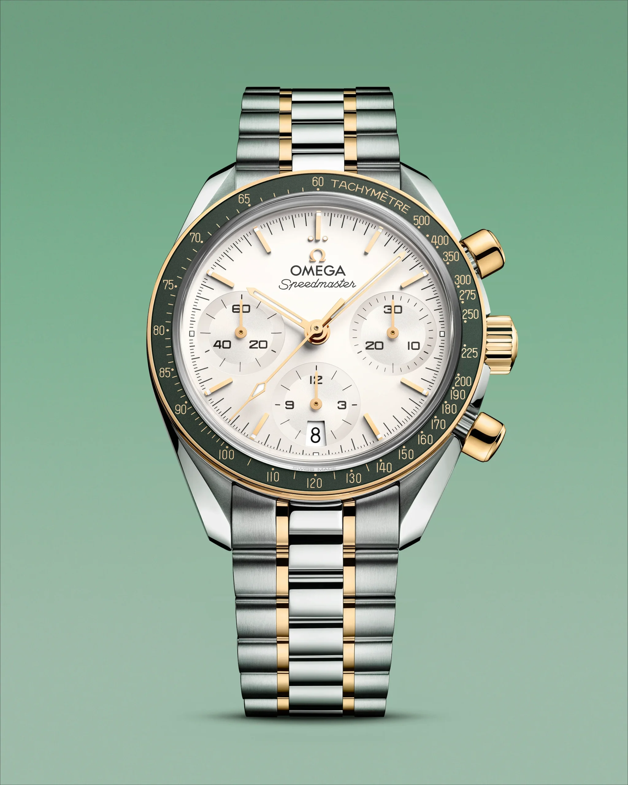 The OMEGA Speedmaster 35 mm with a green aluminium ring and a yellow gold tachymeter scale