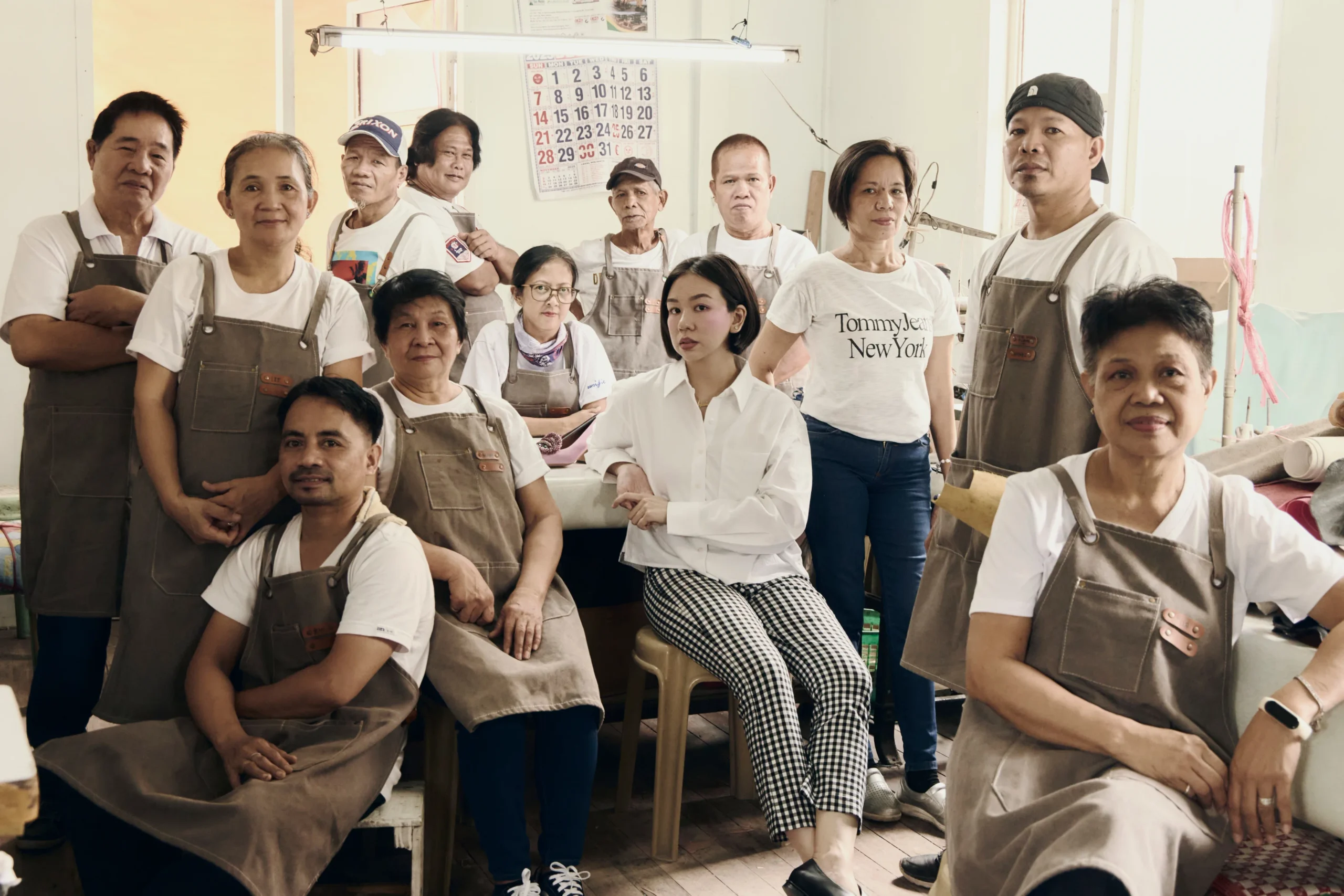 Alexie founder Angelie Alexie Nethercott (front, fifth from left) with shoemakers and artisans