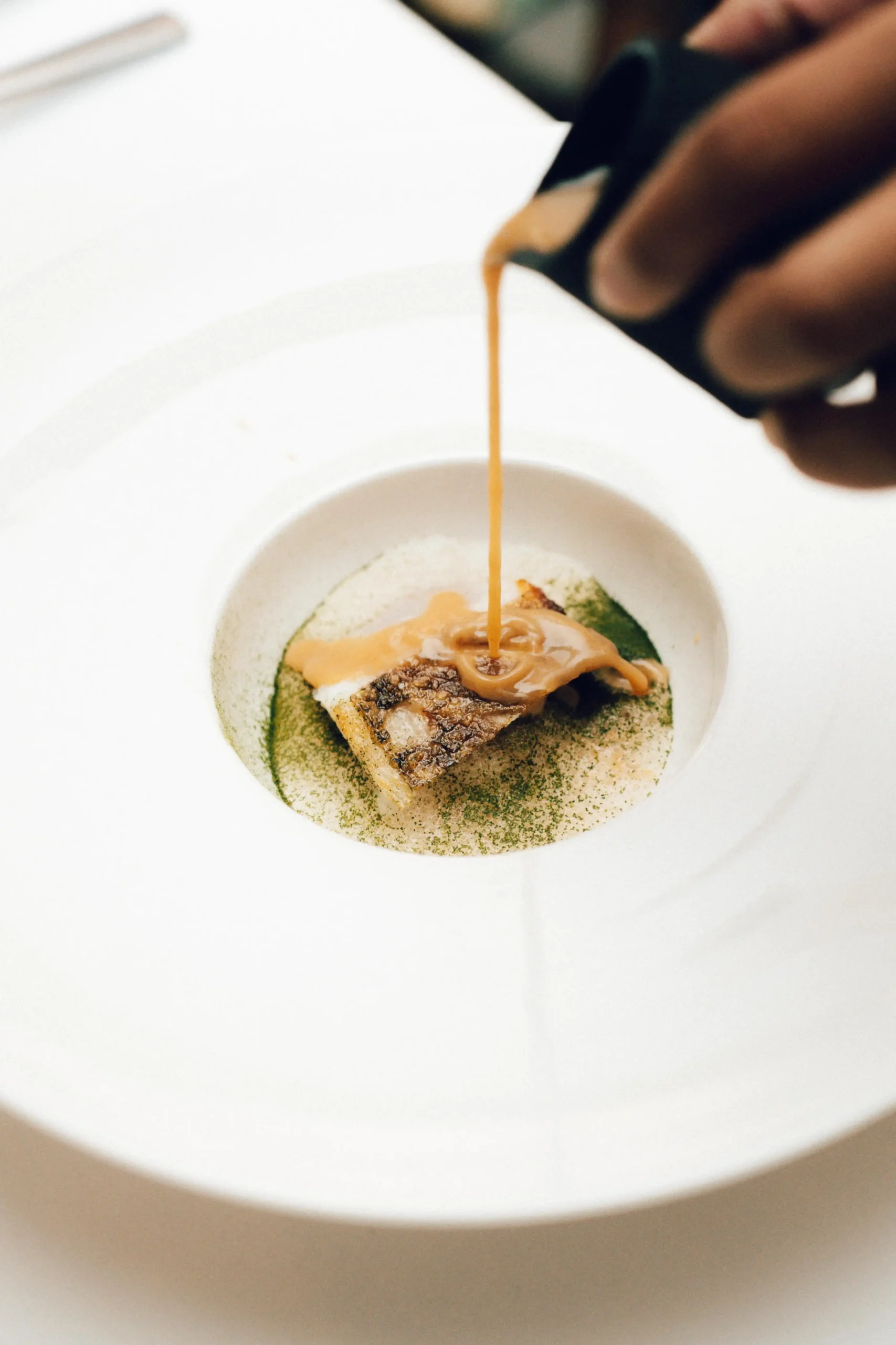 Chefs at work at Tadhana; Binatog (corn tortilla with truffle comte espuna, and coconut snow); and Pakwan (a crispy rice cake with watermelon and miso honey) from Tadhana; Tinapay (laminated tinigib cornbread with tinapa mousse and dalandan sherry marmalade) from Tadhana; Sinigang sa Bayabas (maya maya with batuan, kangkong, and whipped gabi) from Tadhana