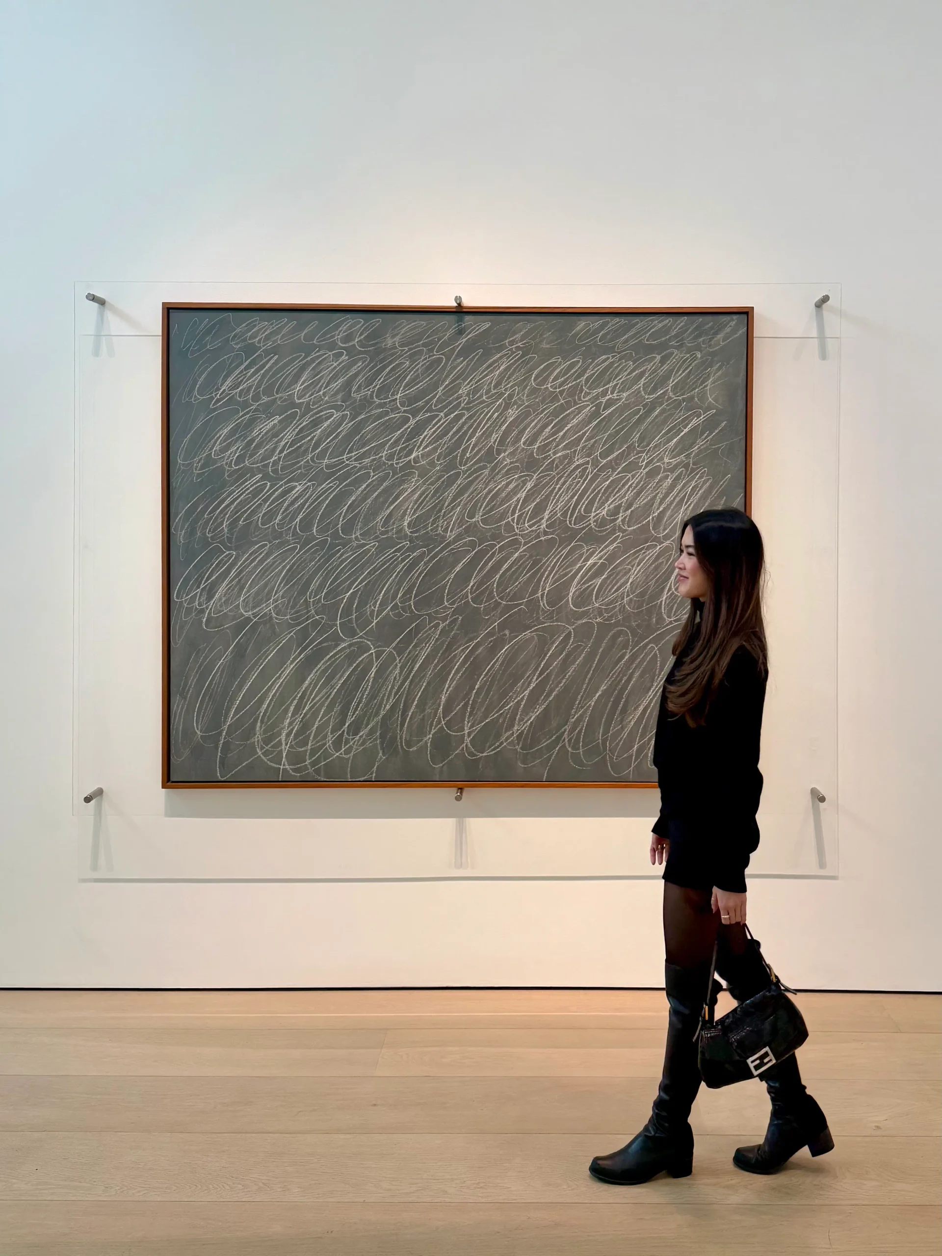 Nicole poses next to one of Cy Twombly's “Blackboard” paintings New York City Art Scene galleries