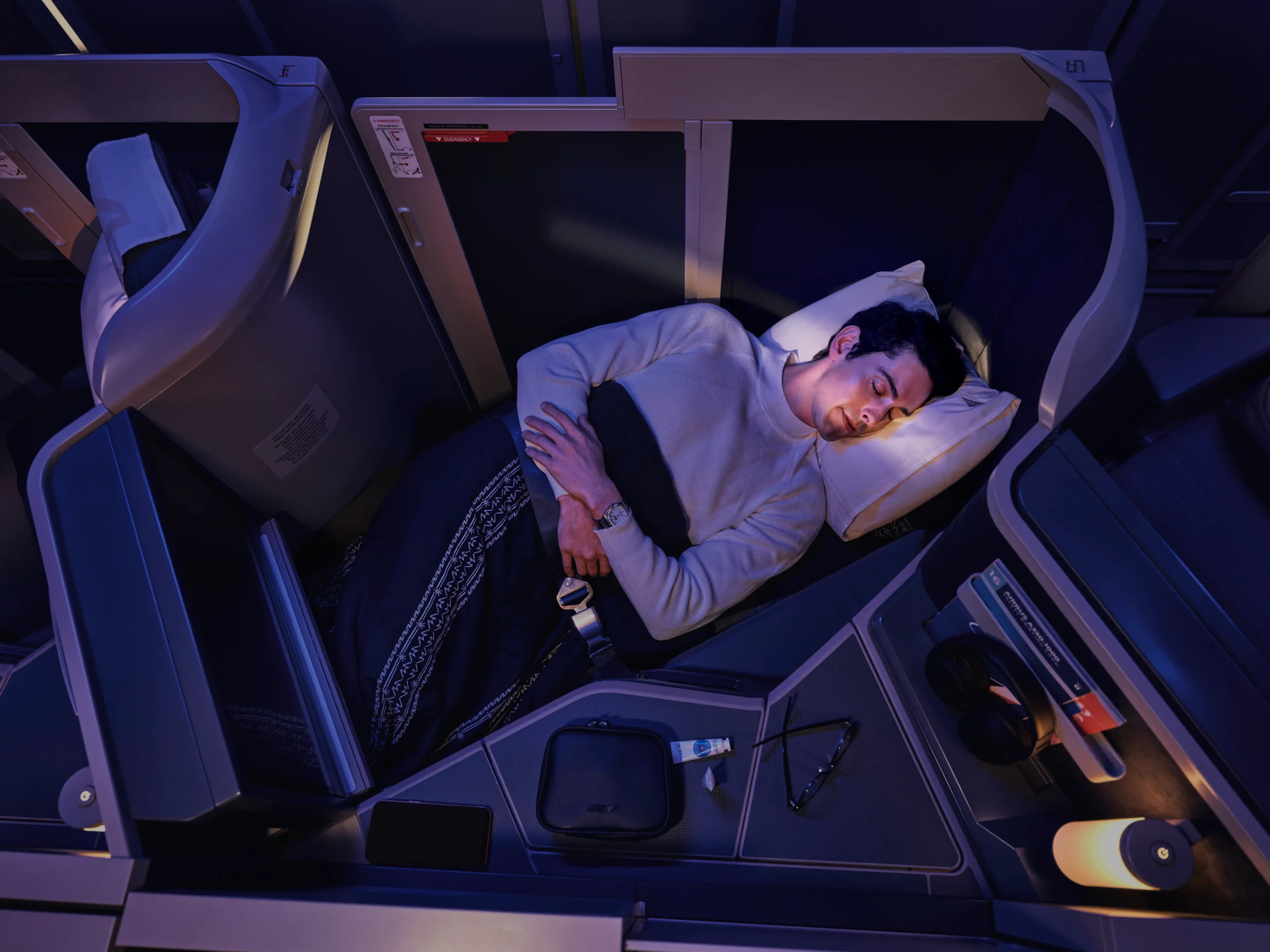 man sleeping on business class philippine airlines