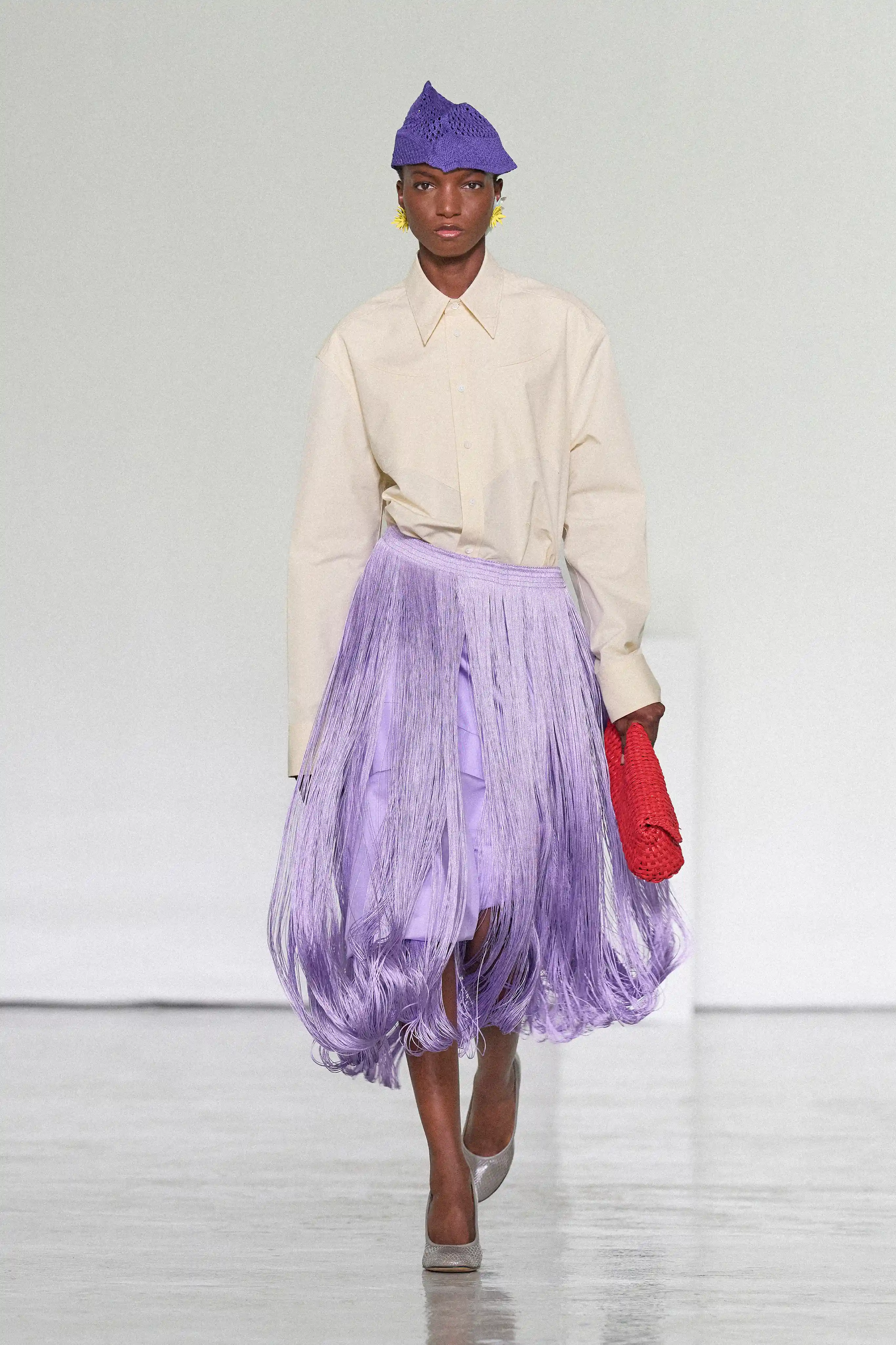 Fringes, poppy reds, and purple hues as seen on the Bottega Veneta Spring/Summer 2027 runway