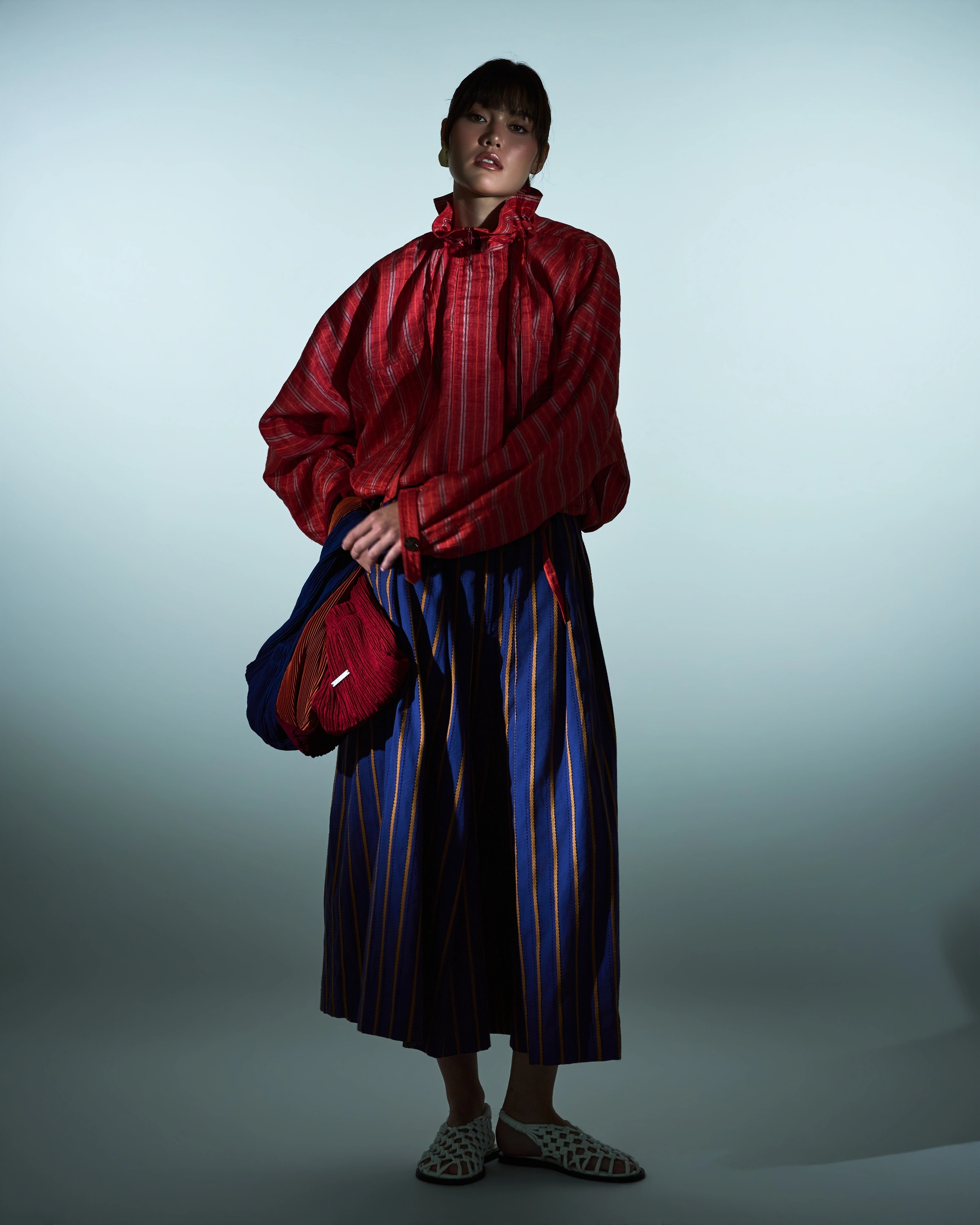 red jacket and striped trousers