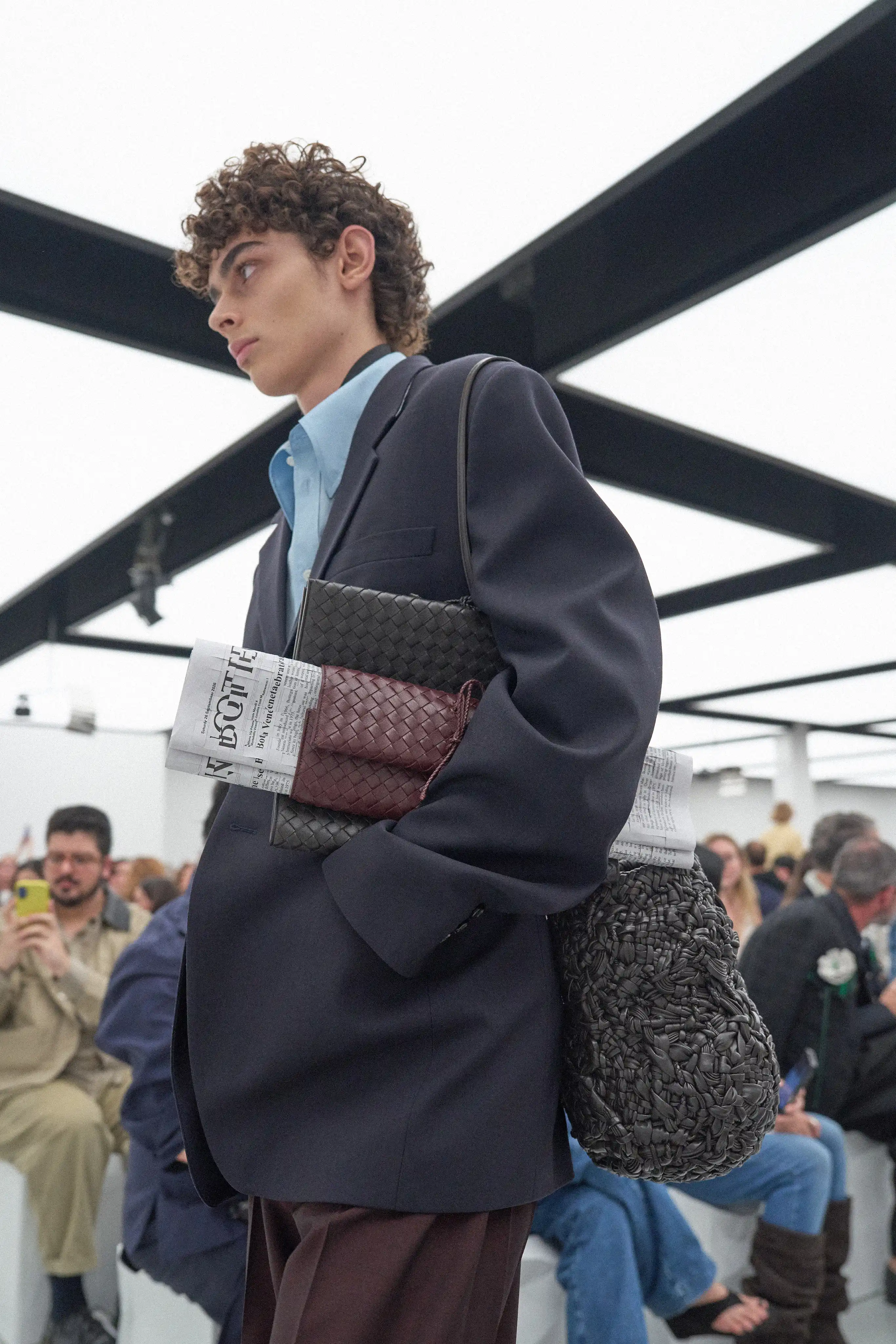 an intrecciato leather newpaper seen on the Bottega Veneta Spring/Summer 2027 runway