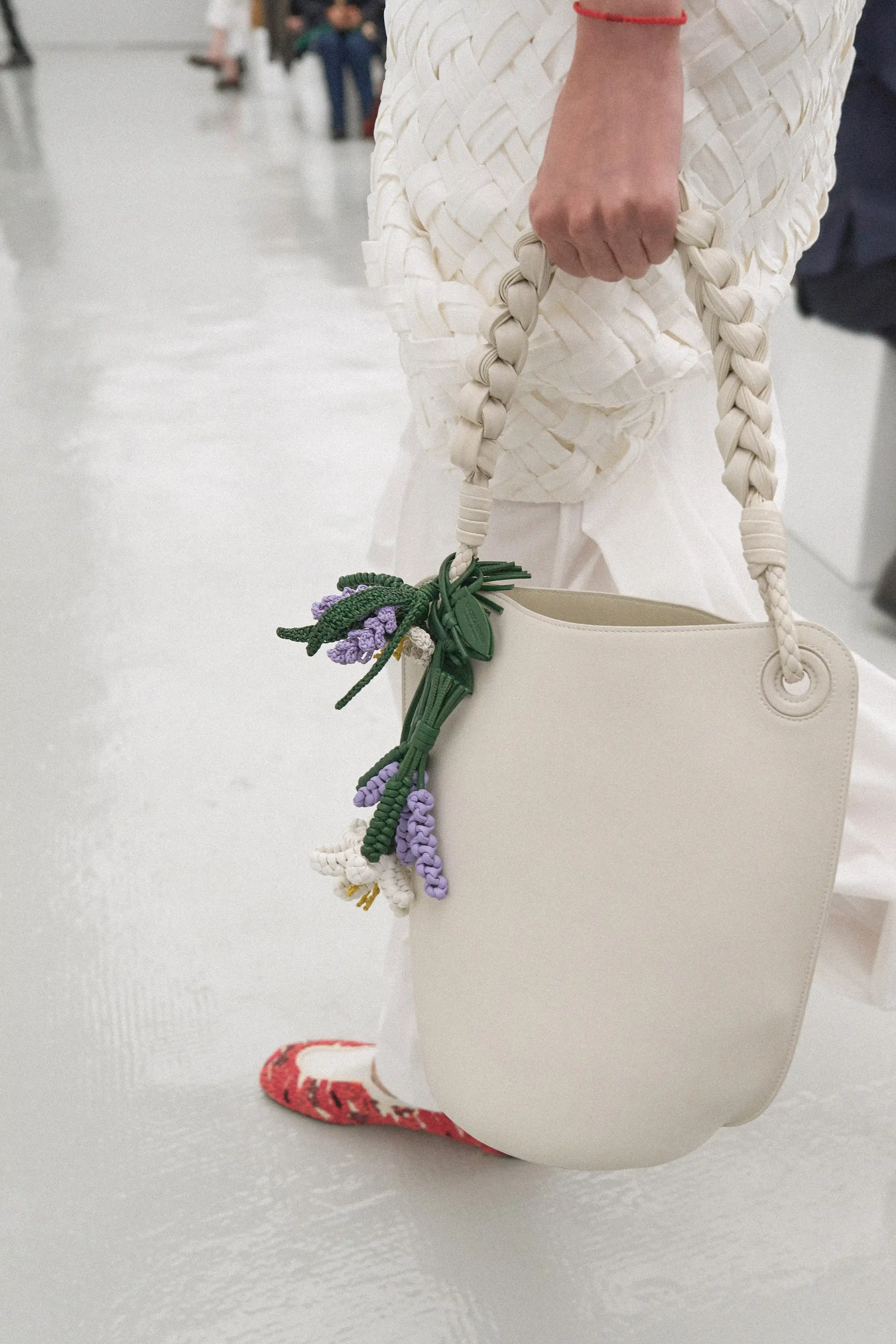 Fringes, poppy reds, and purple hues as seen on the Bottega Veneta Spring/Summer 2027 runway
