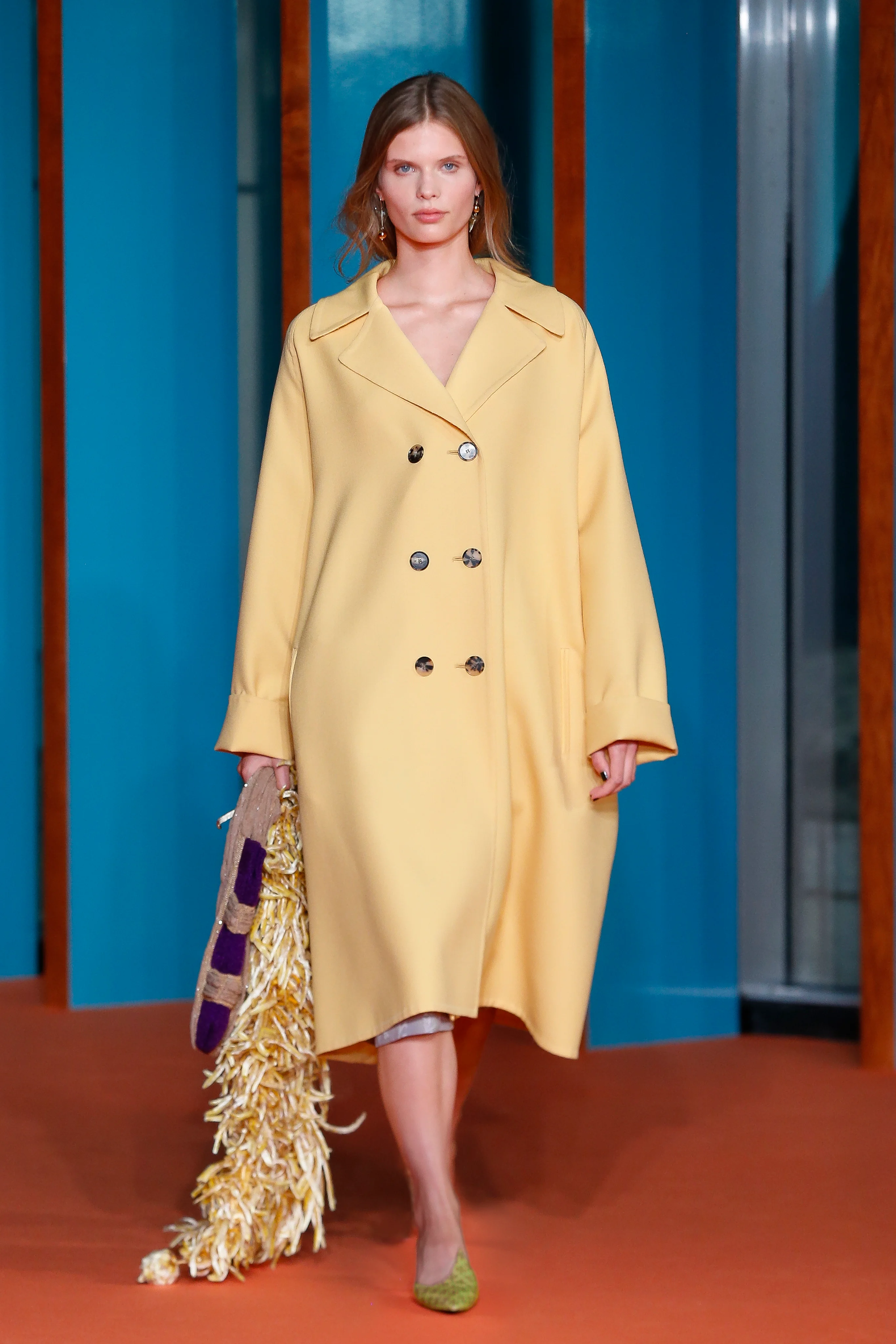 A butter yellow opera coat and a tomato-red low-rise skirt encapsulate that midcentury spirit of 