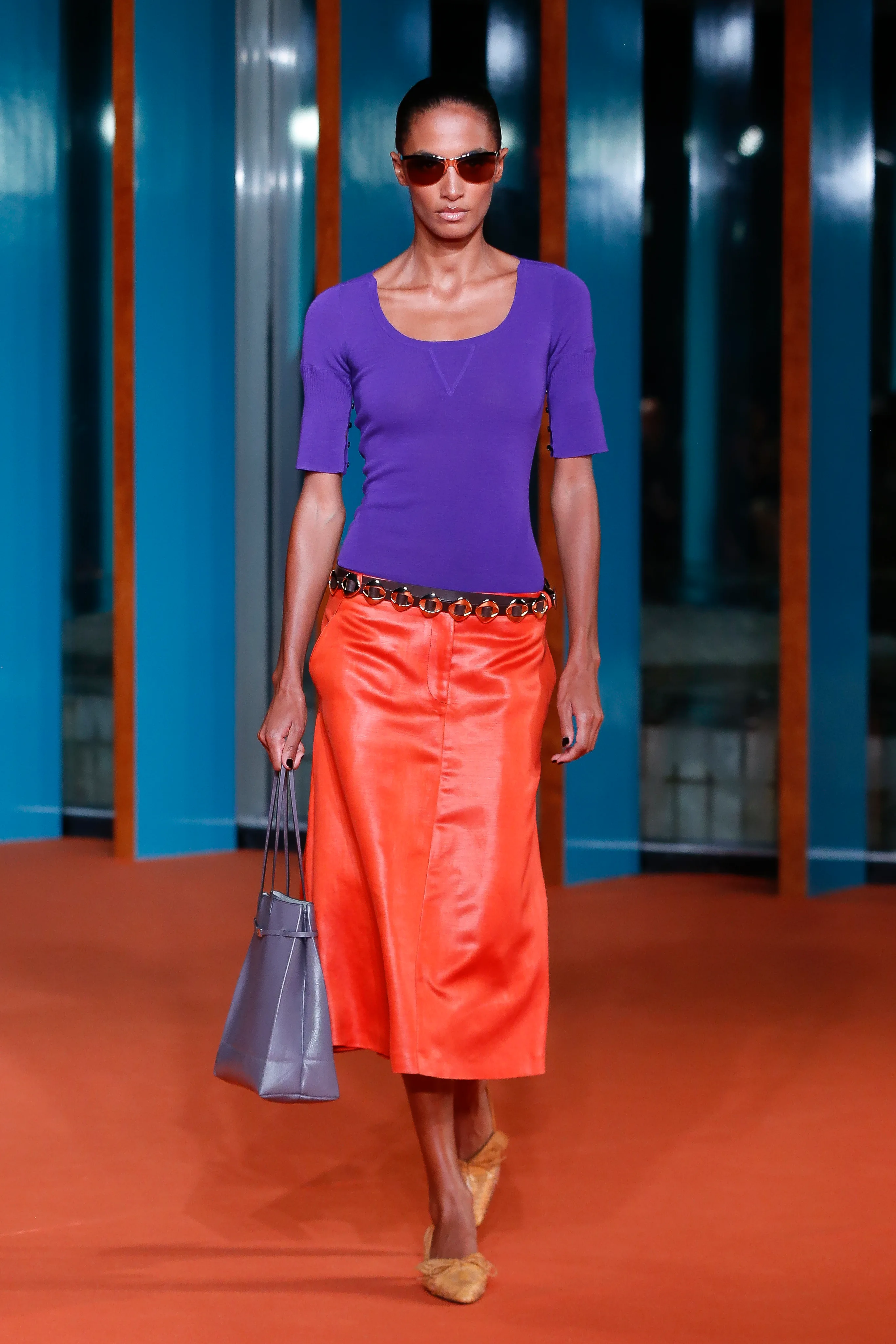 A butter yellow opera coat and a tomato-red low-rise skirt encapsulate that midcentury spirit of 