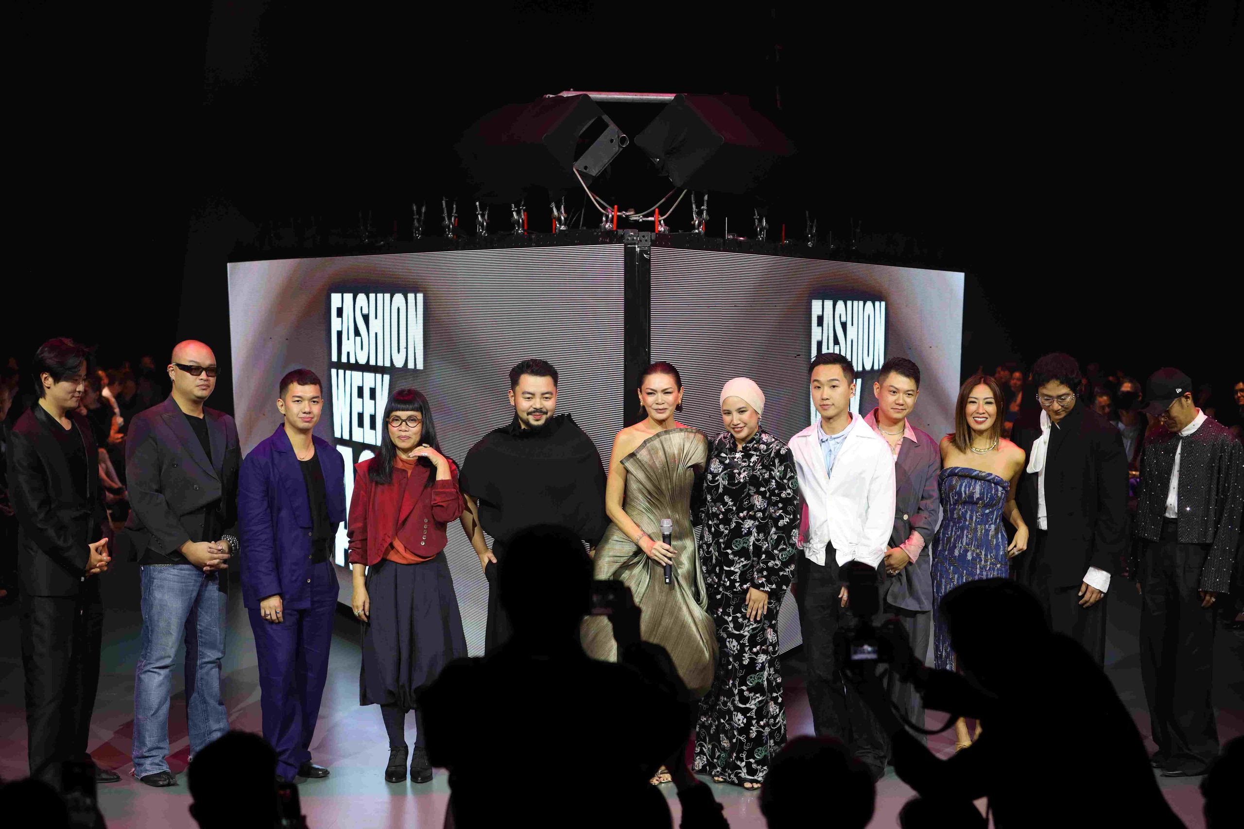 Apples Aberin is joined onstage by the participating designers of Fashion Week Asia 2026