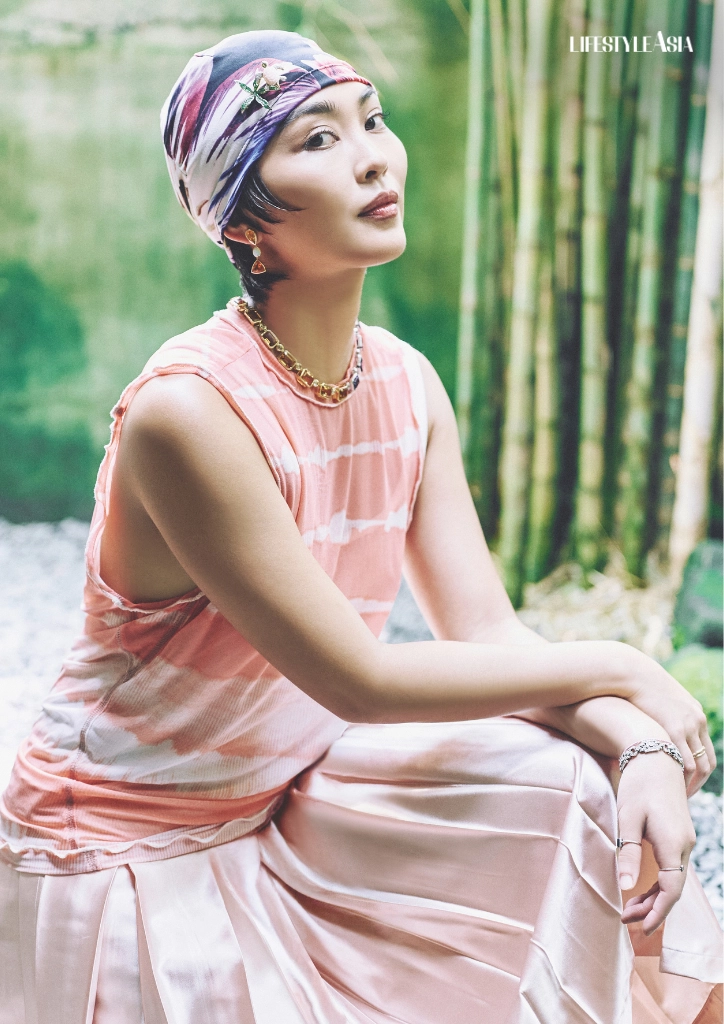 Top, skirt, and skull cap, TOQA; Earrings, necklace, and brooch, JUL B. DIZON
